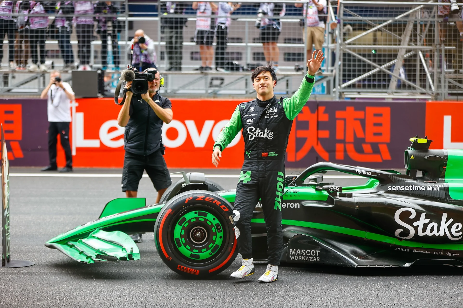 SHANGHAI INTERNATIONAL CIRCUIT, CHINA - APRIL 21: Zhou Guanyu, Stake F1 Team Kick Sauber, gets