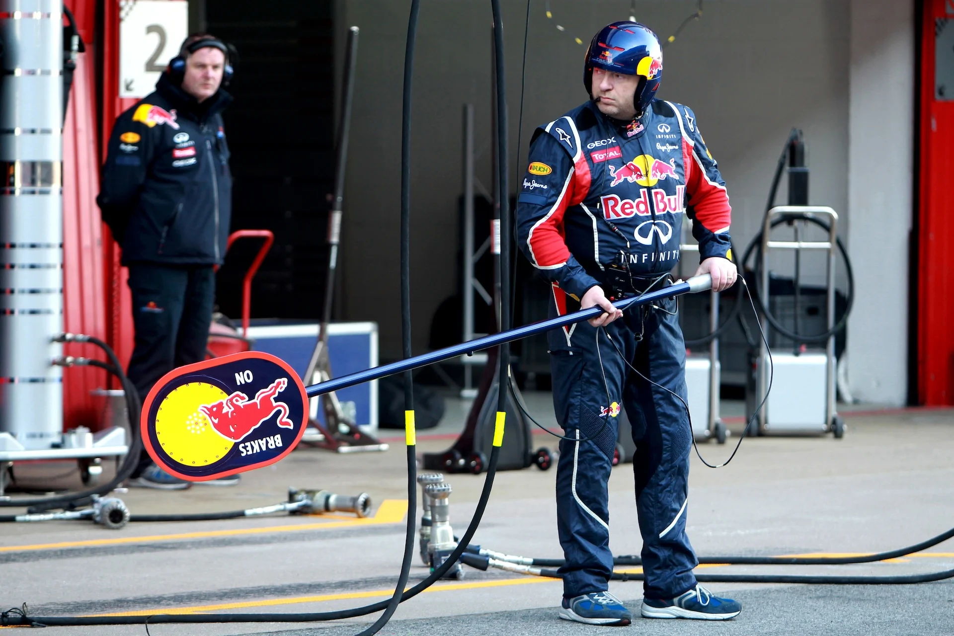 Red Bull Racing mechanics holds the pit stop lollipop. Formula One Testing, Day 3, Barcelona,