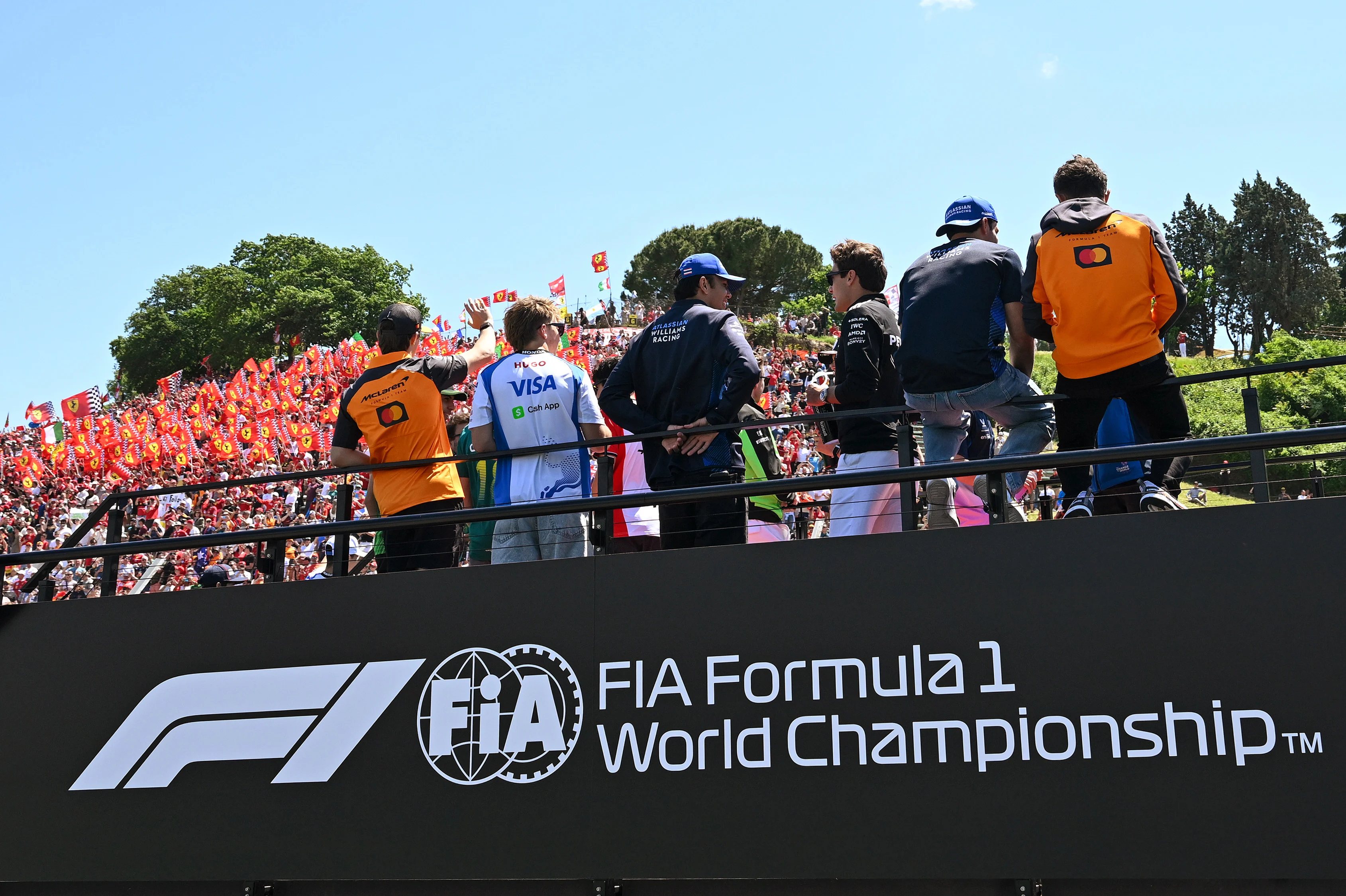IMOLA, ITALY - MAY 18: Oscar Piastri of Australia and McLaren, Liam Lawson of New Zealand and Visa