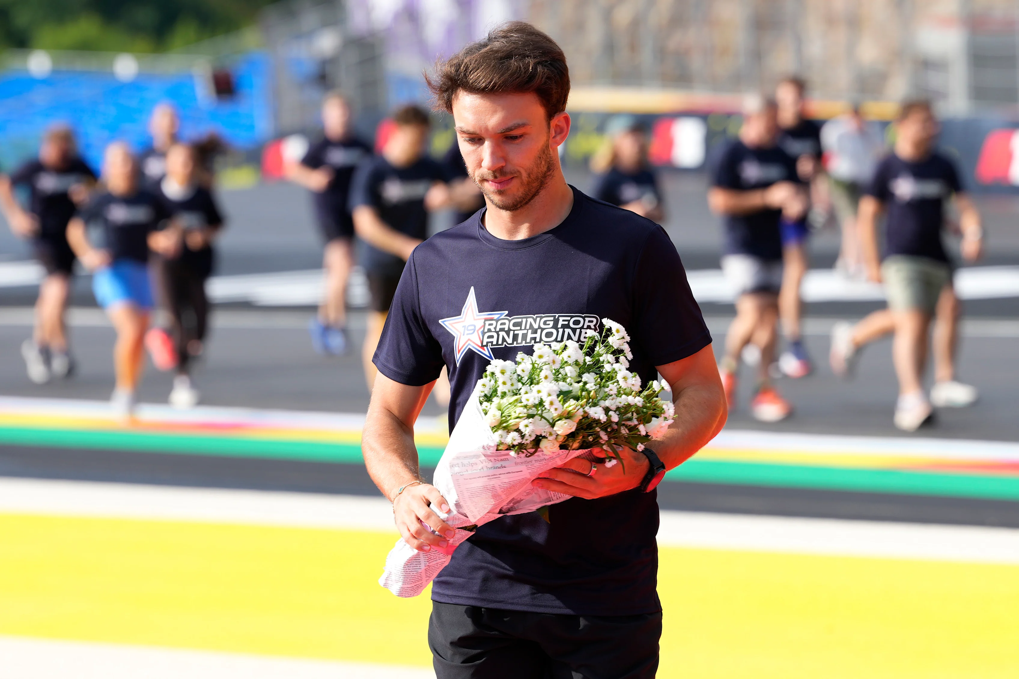 SPA, BELGIUM - JULY 24: Pierre Gasly of France and Alpine F1 lays flowers in tribute to his friend,