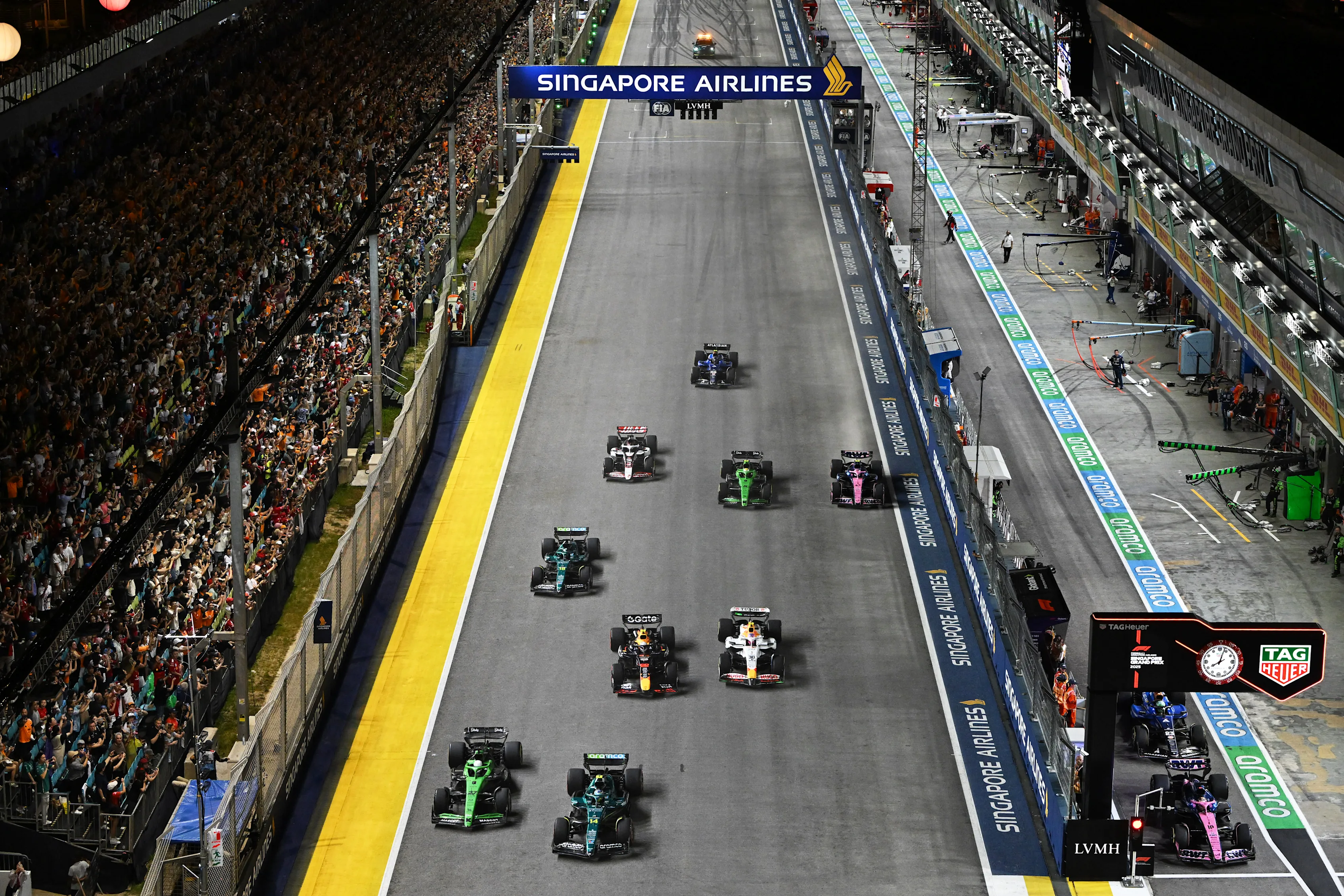 SINGAPORE, SINGAPORE - OCTOBER 05: Fernando Alonso of Spain driving the (14) Aston Martin F1 Team