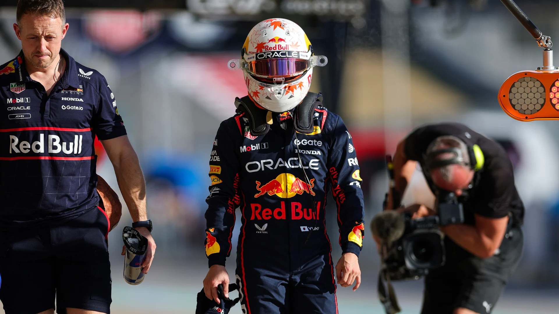 AUSTIN, TEXAS - OCTOBER 17: Yuki Tsunoda of Japan and Oracle Red Bull Racing walks in the Pitlane
