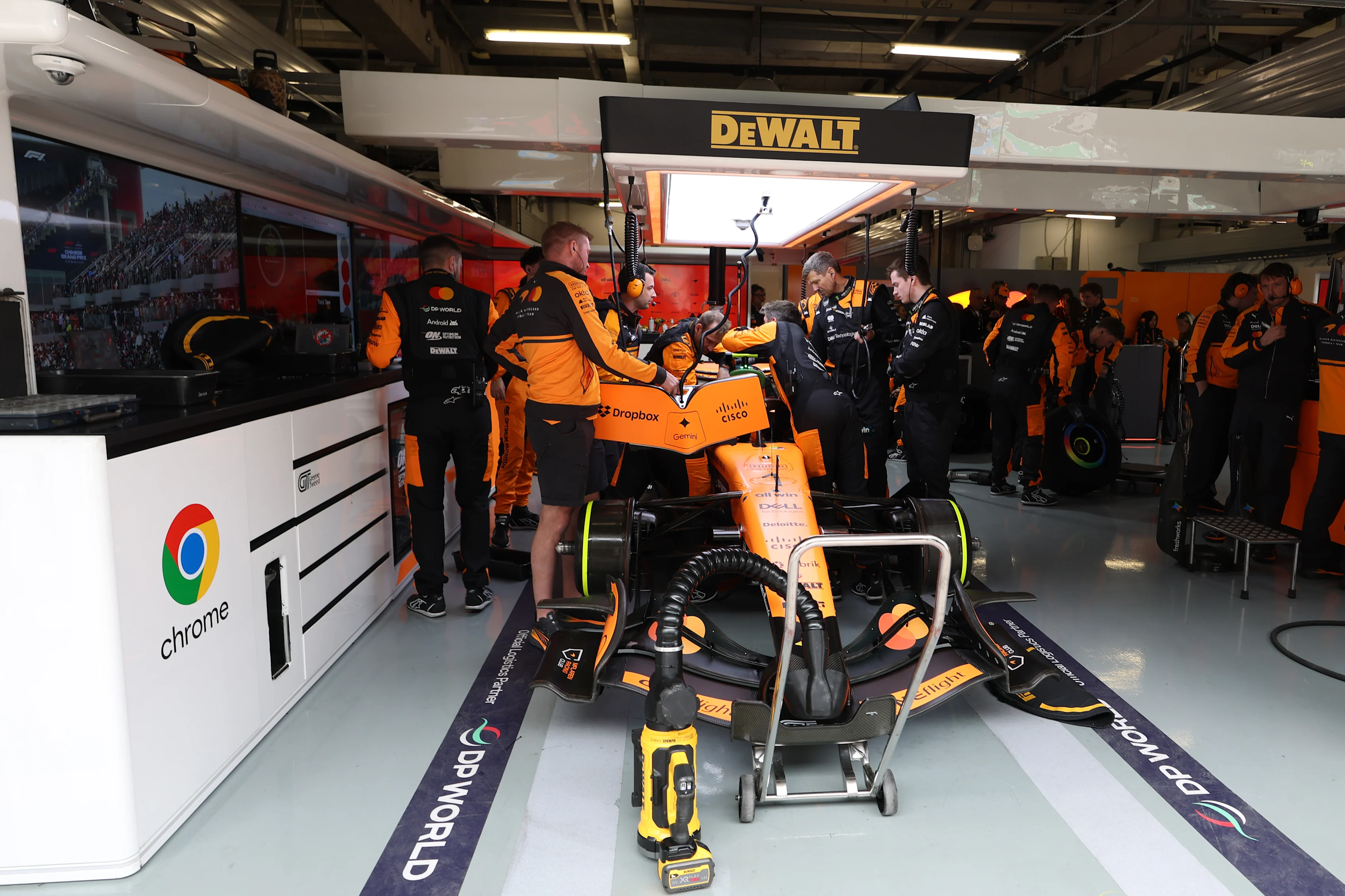SHANGHAI, CHINA - MARCH 15: Mechanics work on the car of Lando Norris of Great Britain driving the