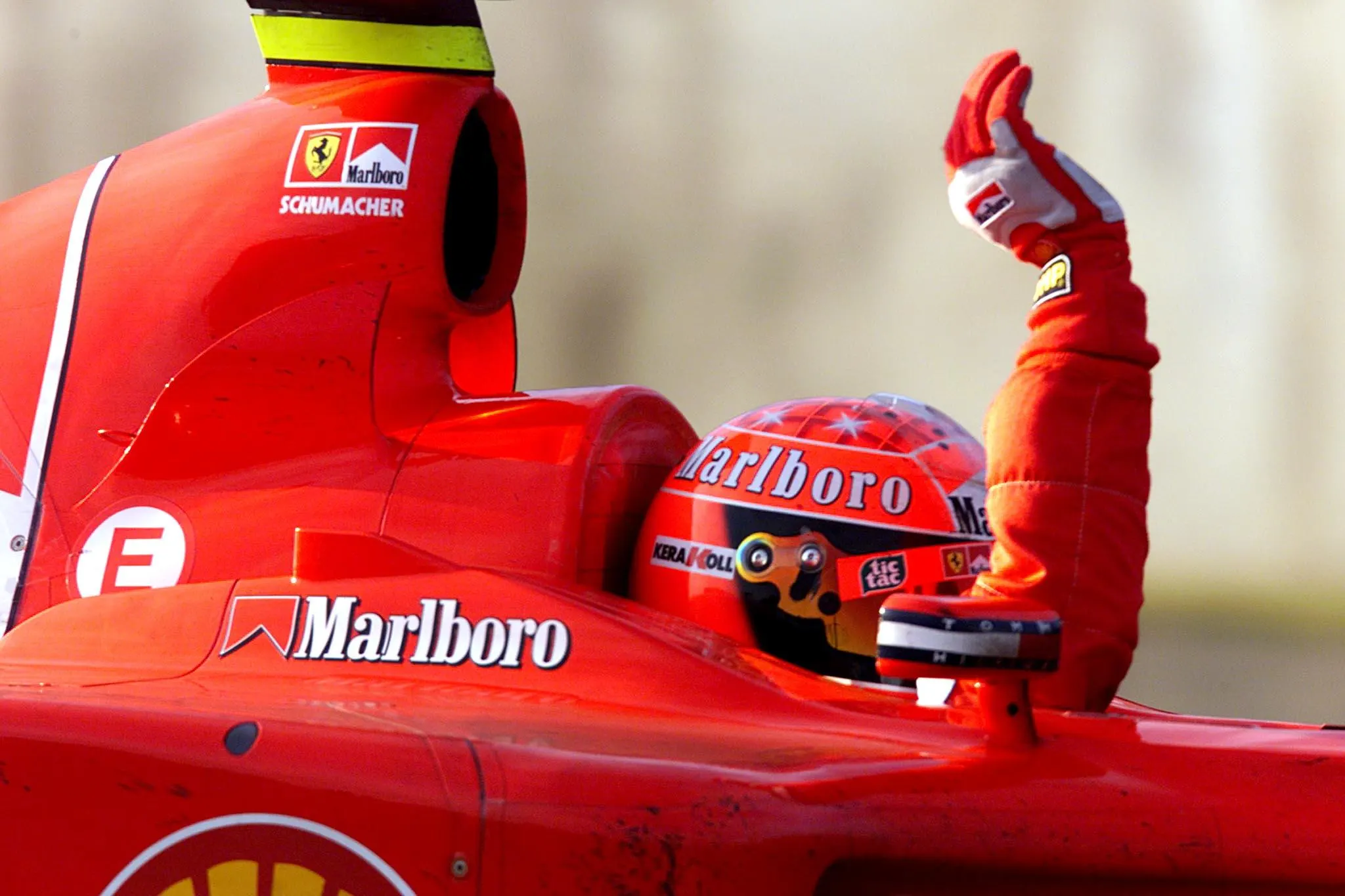 SUZUKA, JAPAN: Ferrari ace Michael Schumacher of Germany waves to Japanese fans after winning at