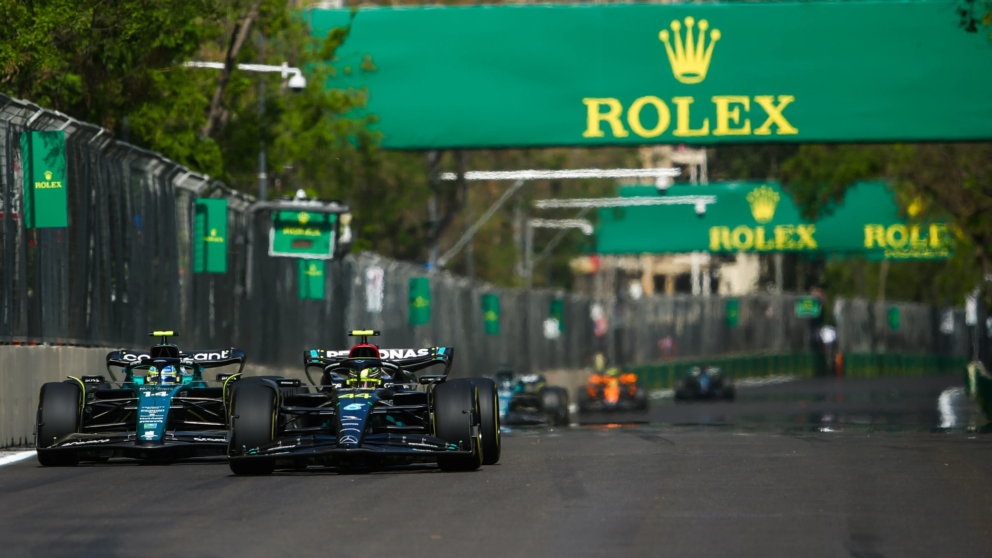 BAKU, AZERBAIJAN - APRIL 30: Lewis Hamilton of Great Britain driving the (44) Mercedes AMG Petronas F1 Team W14 leads Fernando Alonso of Spain driving the (14) Aston Martin AMR23 Mercedes on track during the F1 Grand Prix of Azerbaijan at Baku City Circuit on April 30, 2023 in Baku, Azerbaijan. (Photo by Joe Portlock - Formula 1/Formula 1 via Getty Images)