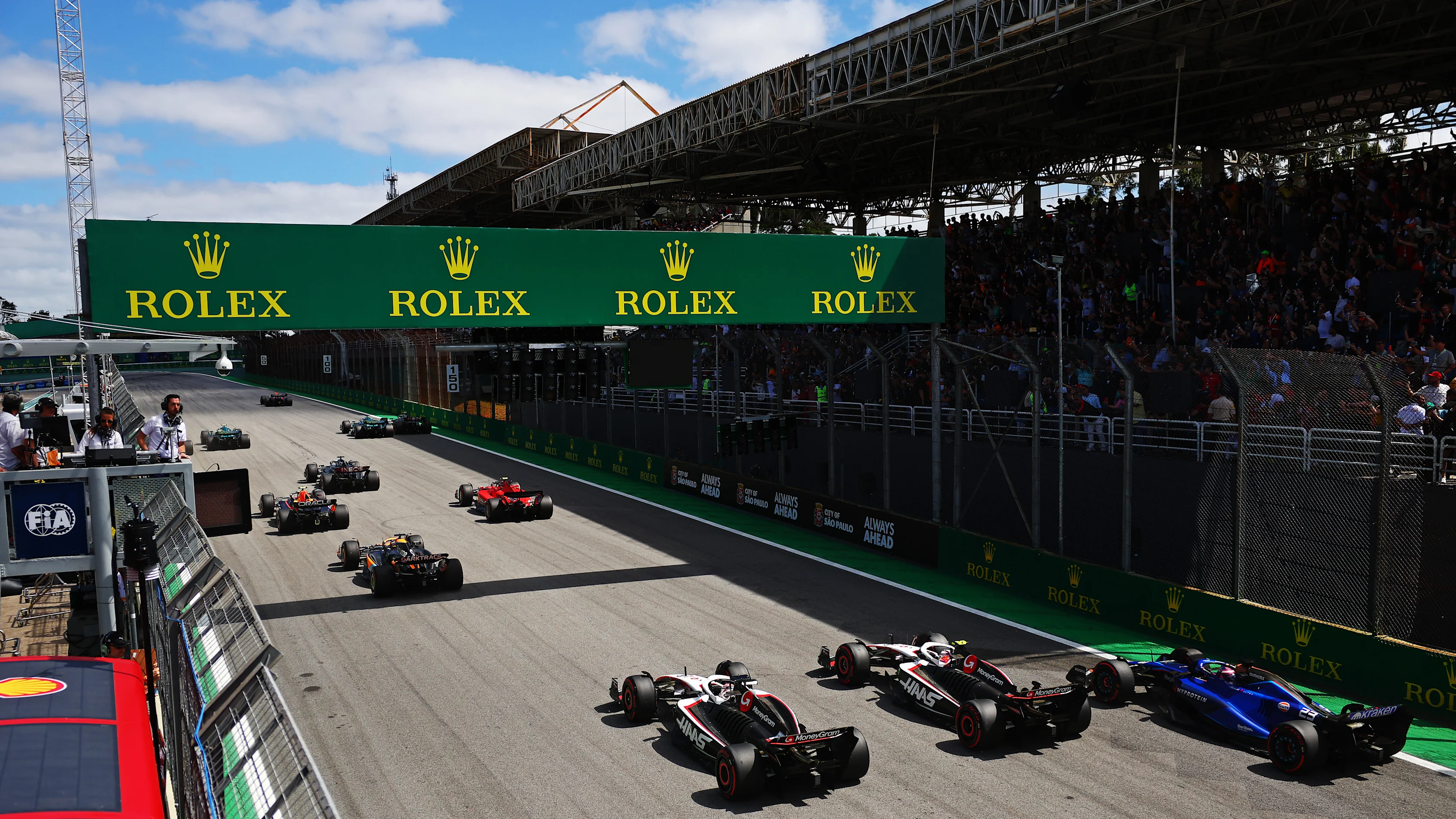 SAO PAULO, BRAZIL - NOVEMBER 05: Kevin Magnussen of Denmark driving the (20) Haas F1 VF-23 Ferrari, Nico Hulkenberg of Germany driving the (27) Haas F1 VF-23 Ferrari and Alexander Albon of Thailand driving the (23) Williams FW45 Mercedes battle for track position into turn one at the start during the F1 Grand Prix of Brazil at Autodromo Jose Carlos Pace on November 05, 2023 in Sao Paulo, Brazil. (Photo by Dan Istitene - Formula 1/Formula 1 via Getty Images)