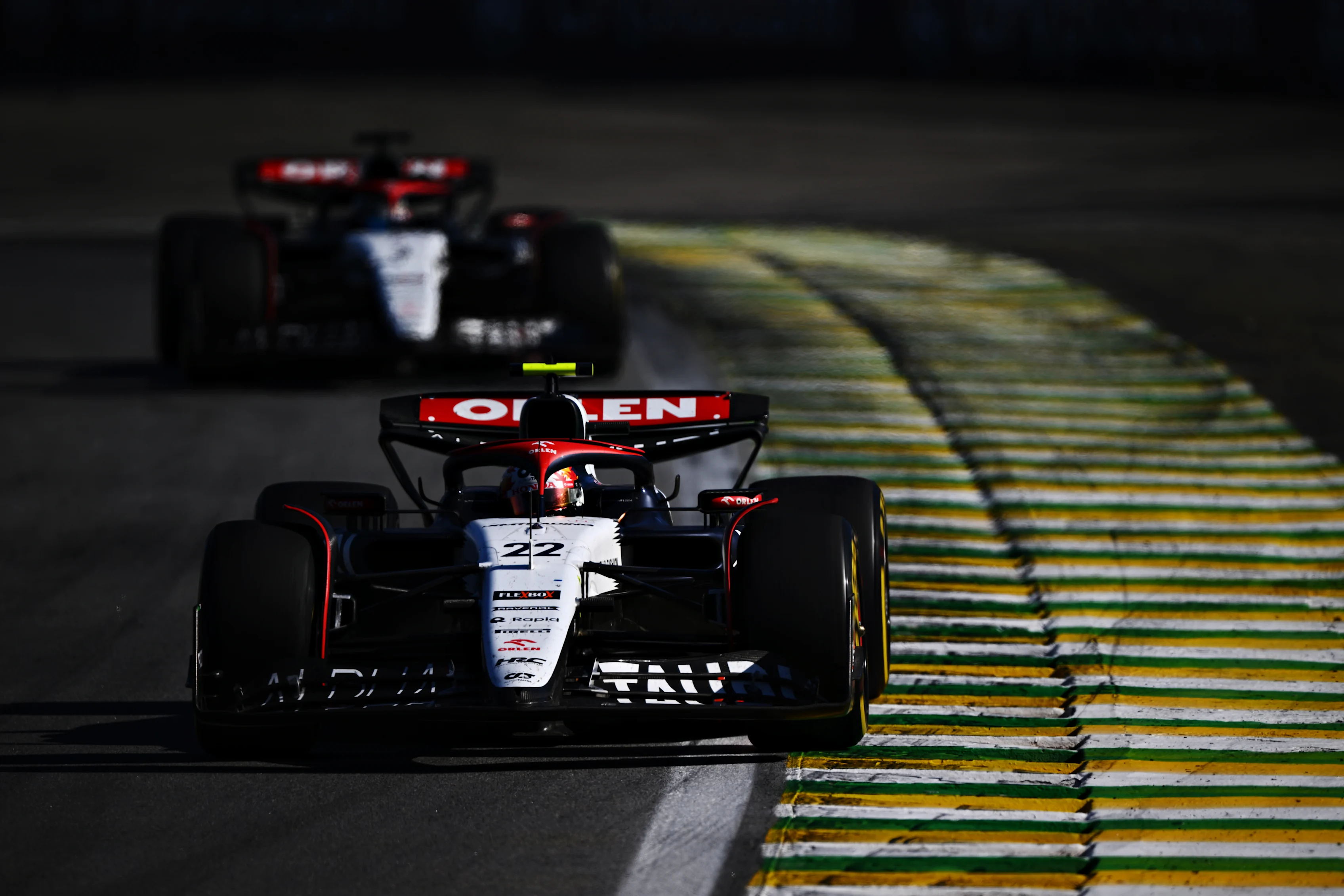SAO PAULO, BRAZIL - NOVEMBER 05: Yuki Tsunoda of Japan driving the (22) Scuderia AlphaTauri AT04 leads Daniel Ricciardo of Australia driving the (3) Scuderia AlphaTauri AT04 on track during the F1 Grand Prix of Brazil at Autodromo Jose Carlos Pace on November 05, 2023 in Sao Paulo, Brazil. (Photo by Clive Mason - Formula 1/Formula 1 via Getty Images)