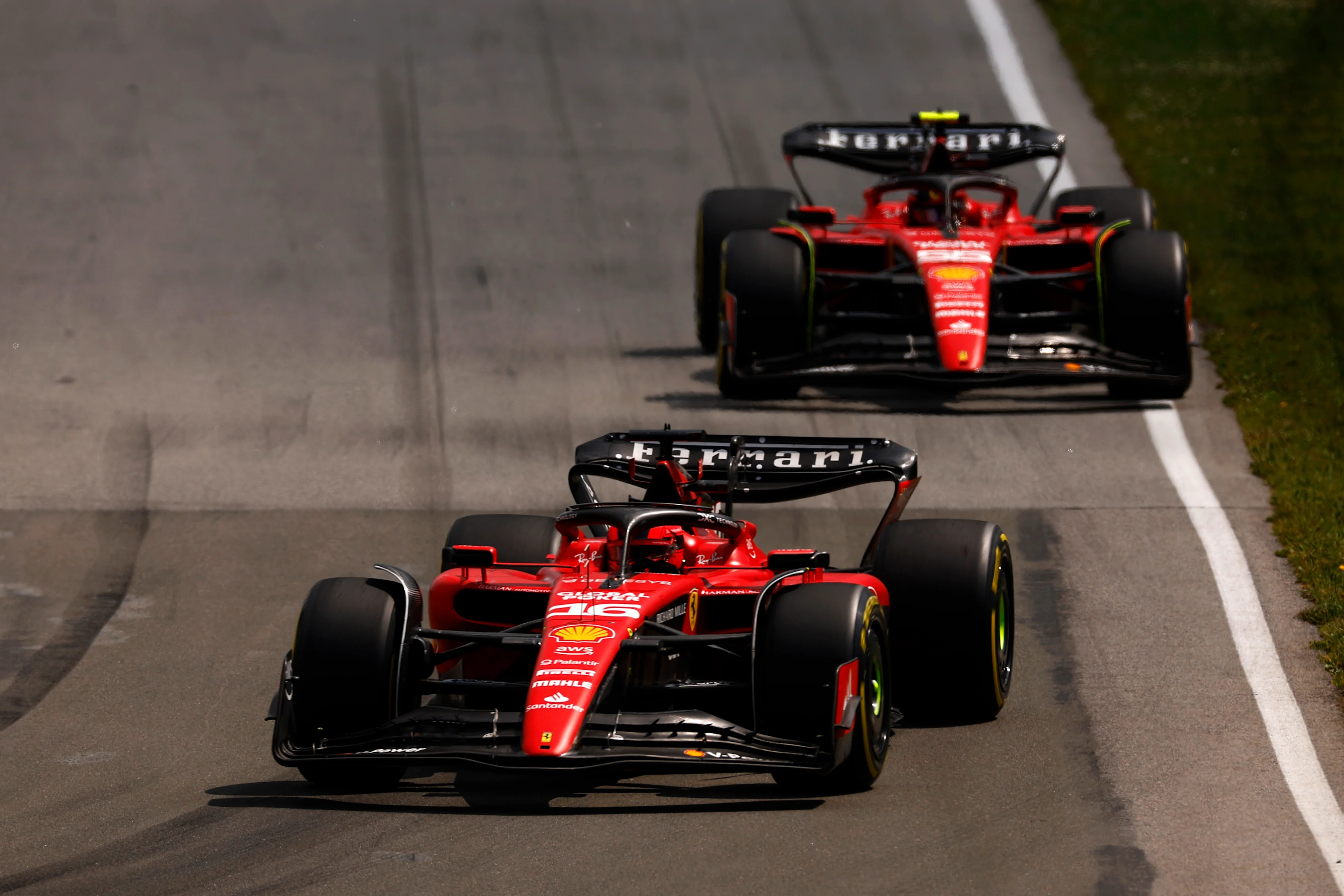 MONTREAL, QUEBEC - JUNE 18: Charles Leclerc of Monaco driving the (16) Ferrari SF-23 leads Carlos
