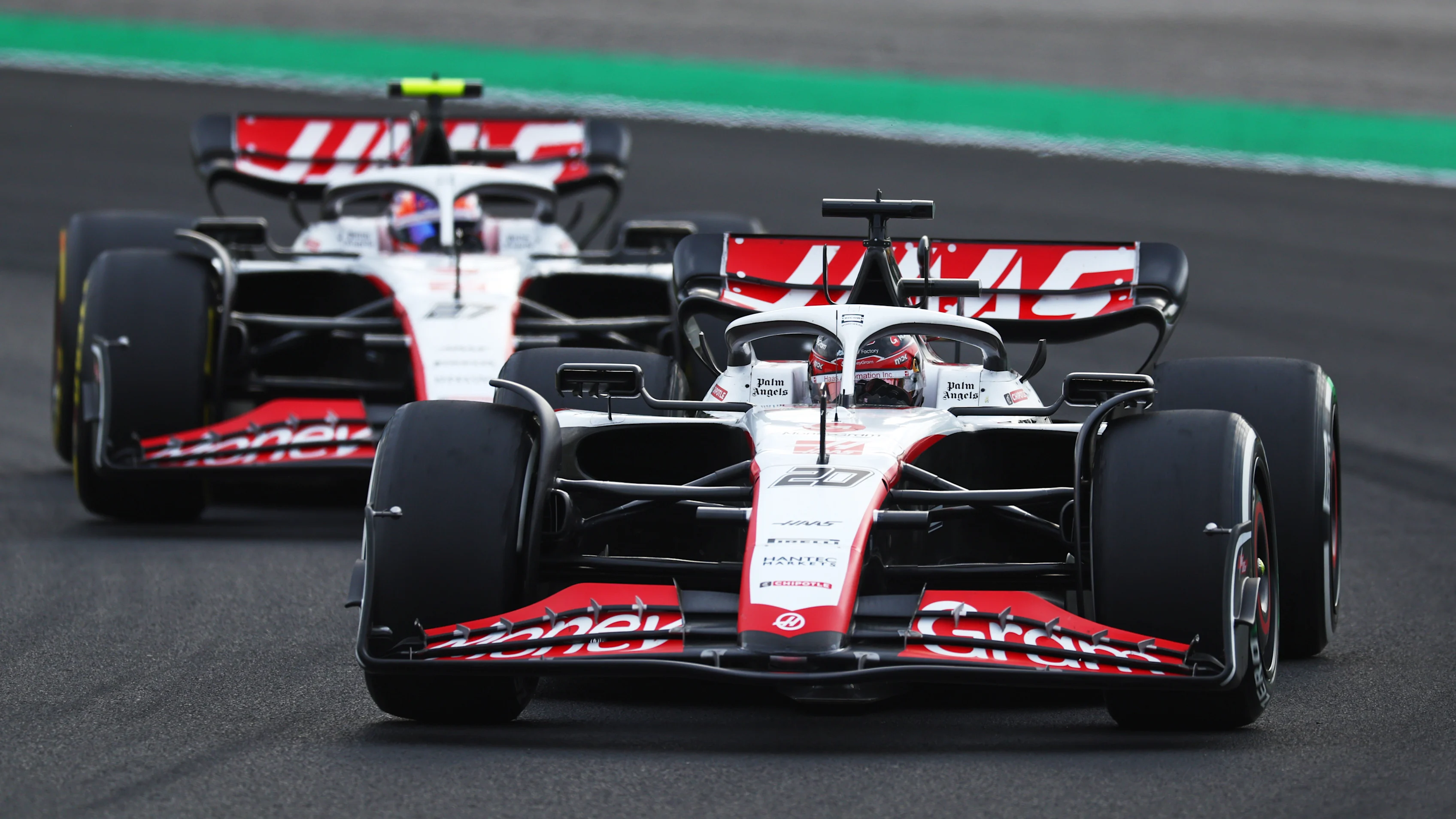 BUDAPEST, HUNGARY - JULY 21: Kevin Magnussen of Denmark driving the (20) Haas F1 VF-23 Ferrari leads Nico Hulkenberg of Germany driving the (27) Haas F1 VF-23 Ferrari during practice ahead of the F1 Grand Prix of Hungary at Hungaroring on July 21, 2023 in Budapest, Hungary. (Photo by Bryn Lennon - Formula 1/Formula 1 via Getty Images)