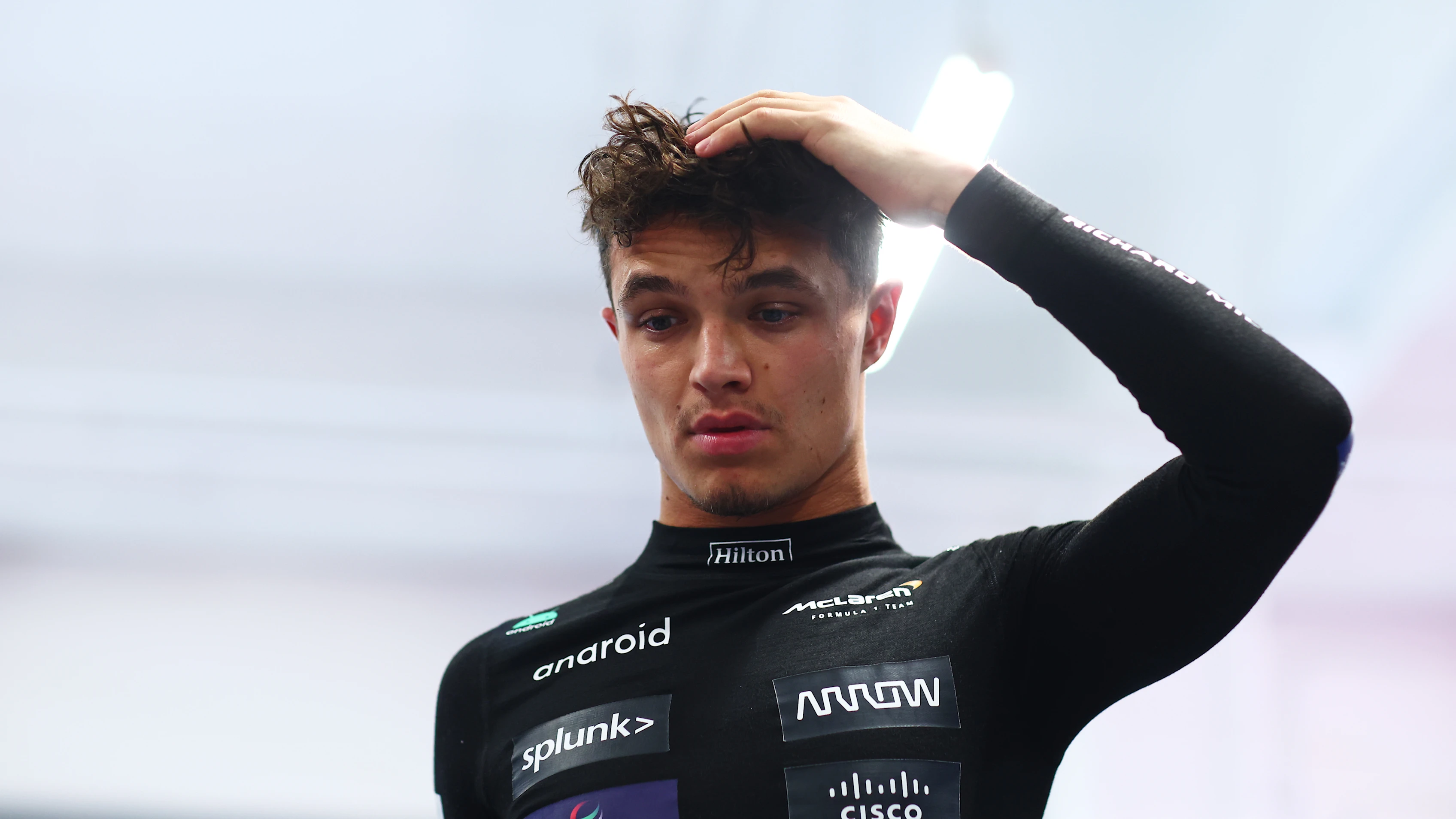 LAS VEGAS, NEVADA - NOVEMBER 18: Sixteenth placed qualifier Lando Norris of Great Britain and McLaren looks on in the FIA Garage after qualifying ahead of the F1 Grand Prix of Las Vegas at Las Vegas Strip Circuit on November 18, 2023 in Las Vegas, Nevada. (Photo by Dan Istitene - Formula 1/Formula 1 via Getty Images)