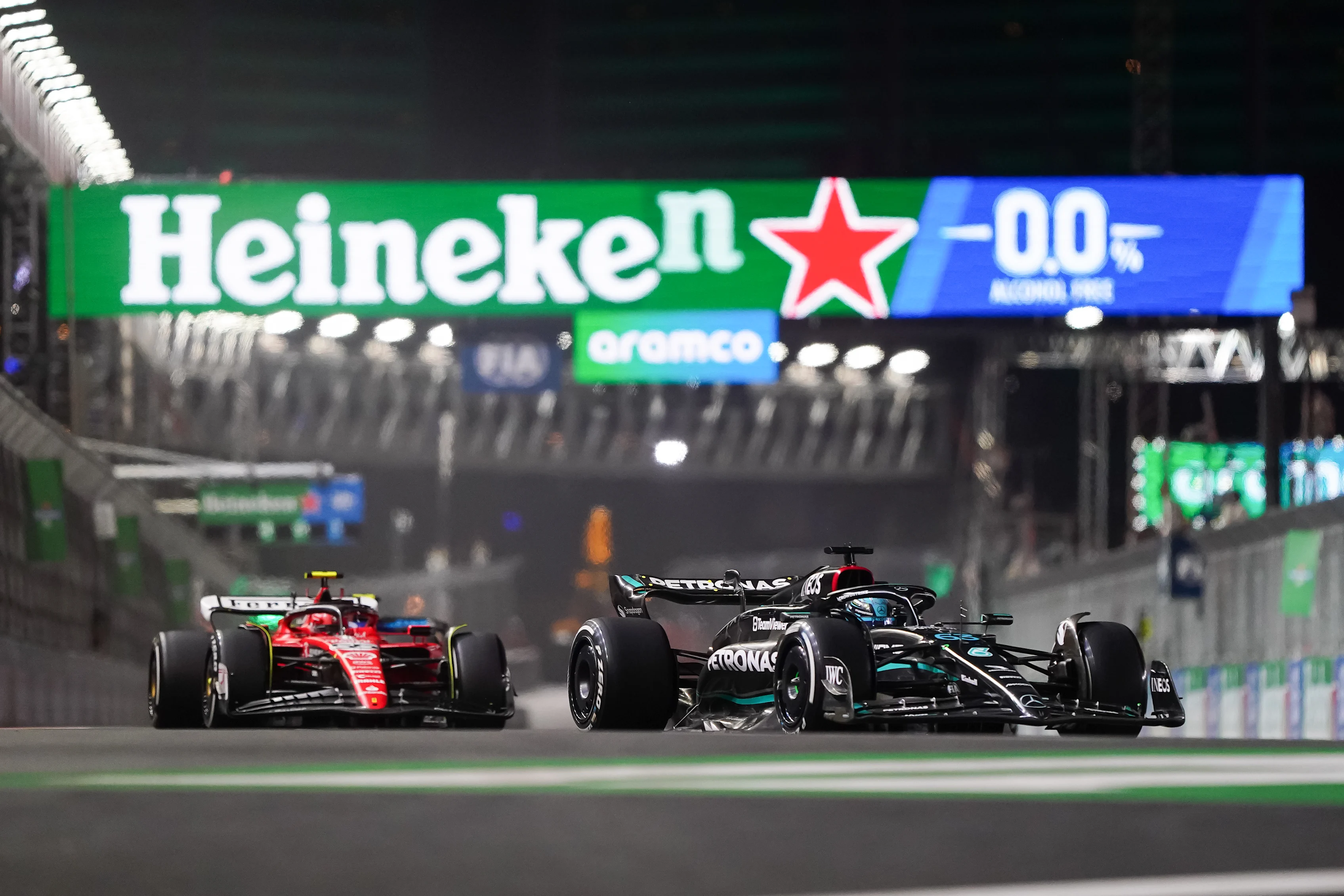 LAS VEGAS, NEVADA - NOVEMBER 18: George Russell of Great Britain and Mercedes and Charles Leclerc