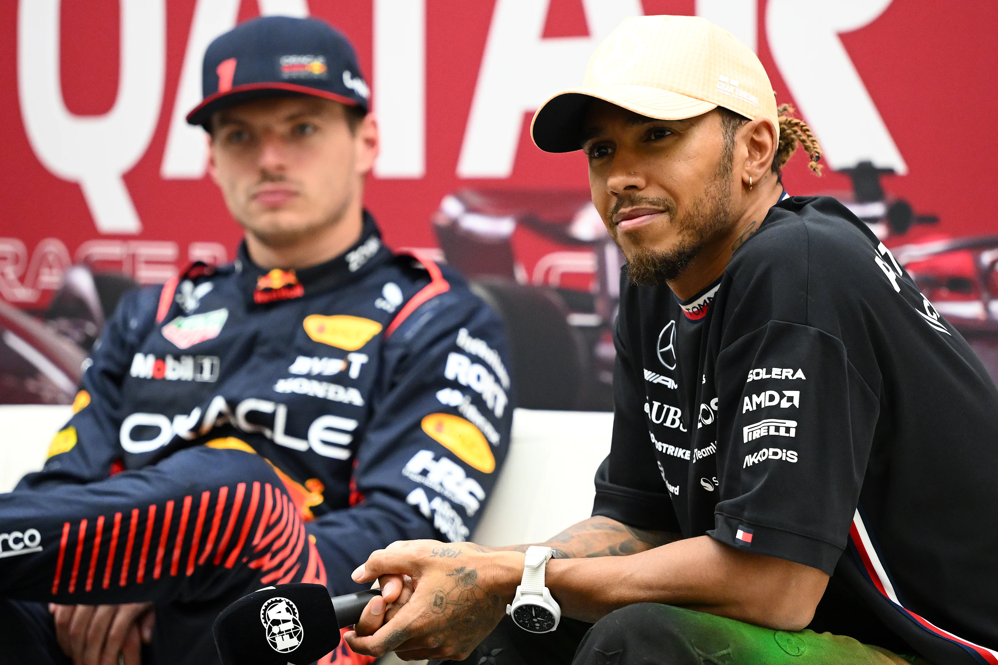LUSAIL CITY, QATAR - OCTOBER 06: Third placed qualifier Lewis Hamilton of Great Britain and Mercedes and Pole position qualifier Max Verstappen of the Netherlands and Oracle Red Bull Racing attend the press conference after qualifying ahead of the F1 Grand Prix of Qatar at Lusail International Circuit on October 06, 2023 in Lusail City, Qatar. (Photo by Clive Mason/Getty Images)
