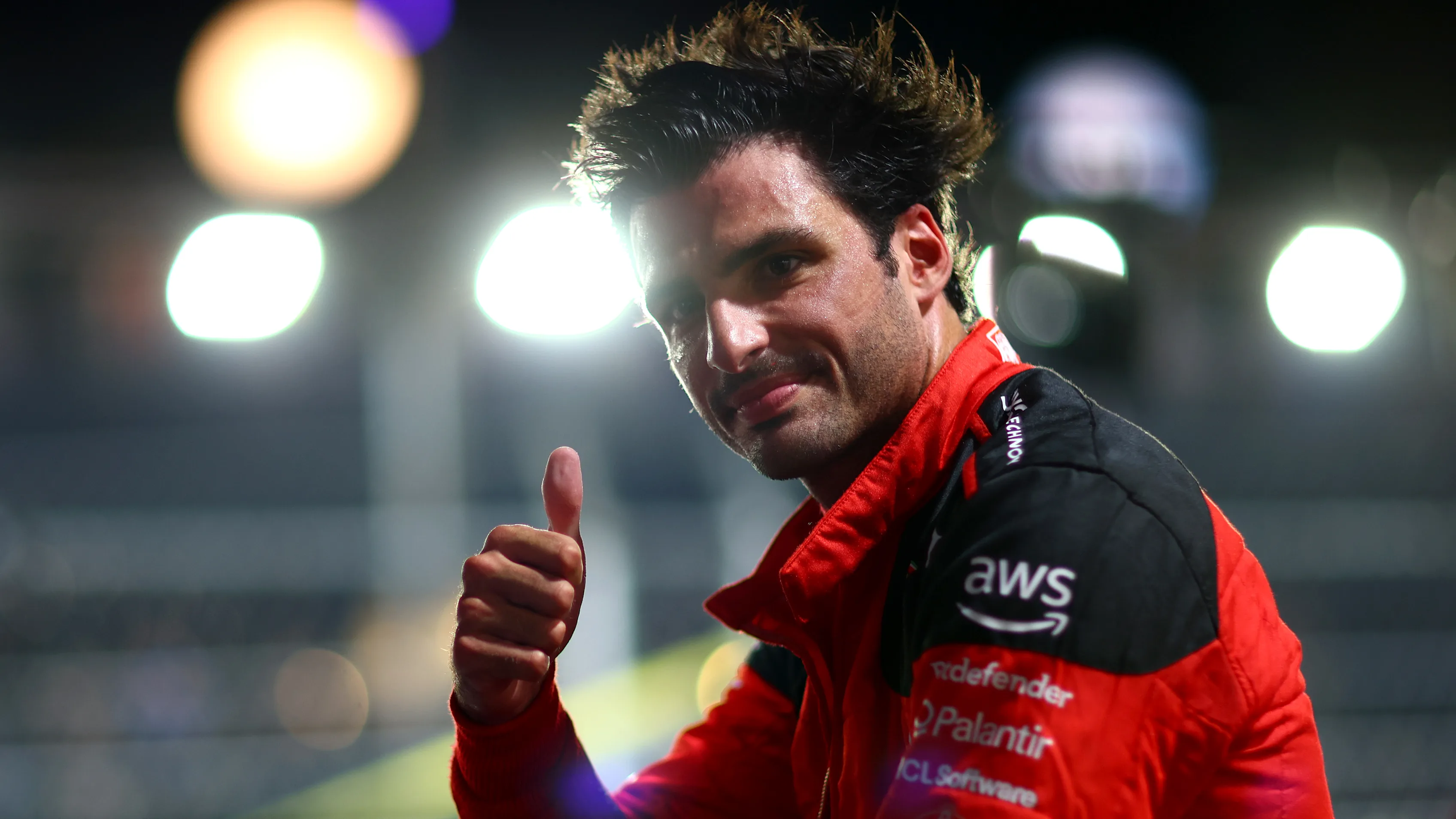 SINGAPORE, SINGAPORE - SEPTEMBER 16: Pole position qualifier Carlos Sainz of Spain and Ferrari