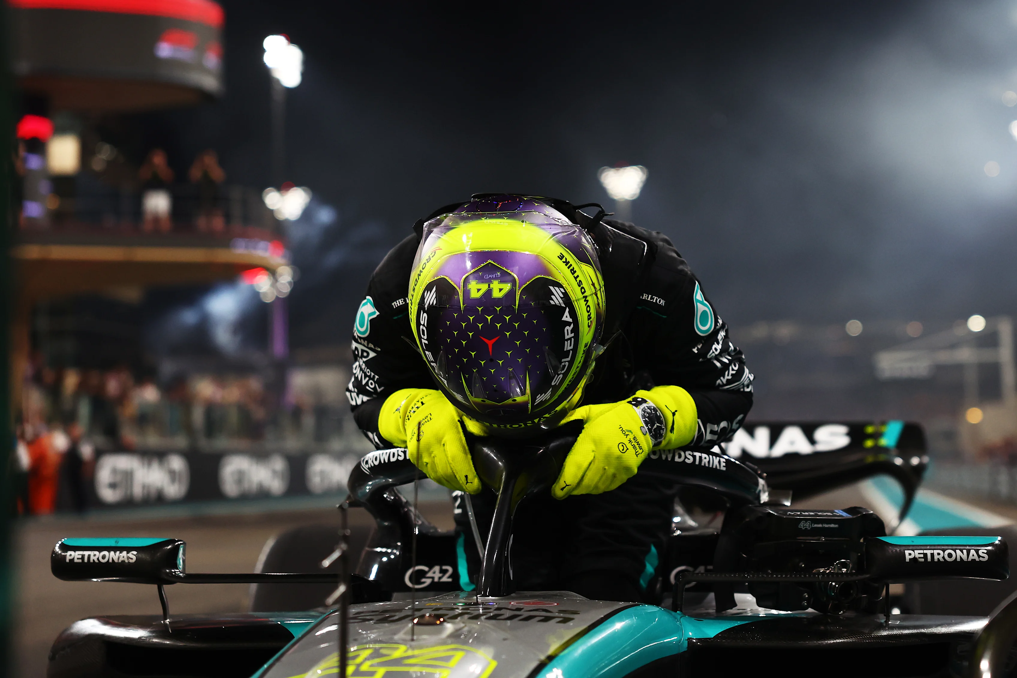 ABU DHABI, UNITED ARAB EMIRATES - DECEMBER 08: 4th placed Lewis Hamilton of Great Britain and Mercedes reacts after performing donuts on track for his final race with Mercedes during the F1 Grand Prix of Abu Dhabi at Yas Marina Circuit on December 08, 2024 in Abu Dhabi, United Arab Emirates. (Photo by Bryn Lennon - Formula 1/Formula 1 via Getty Images)