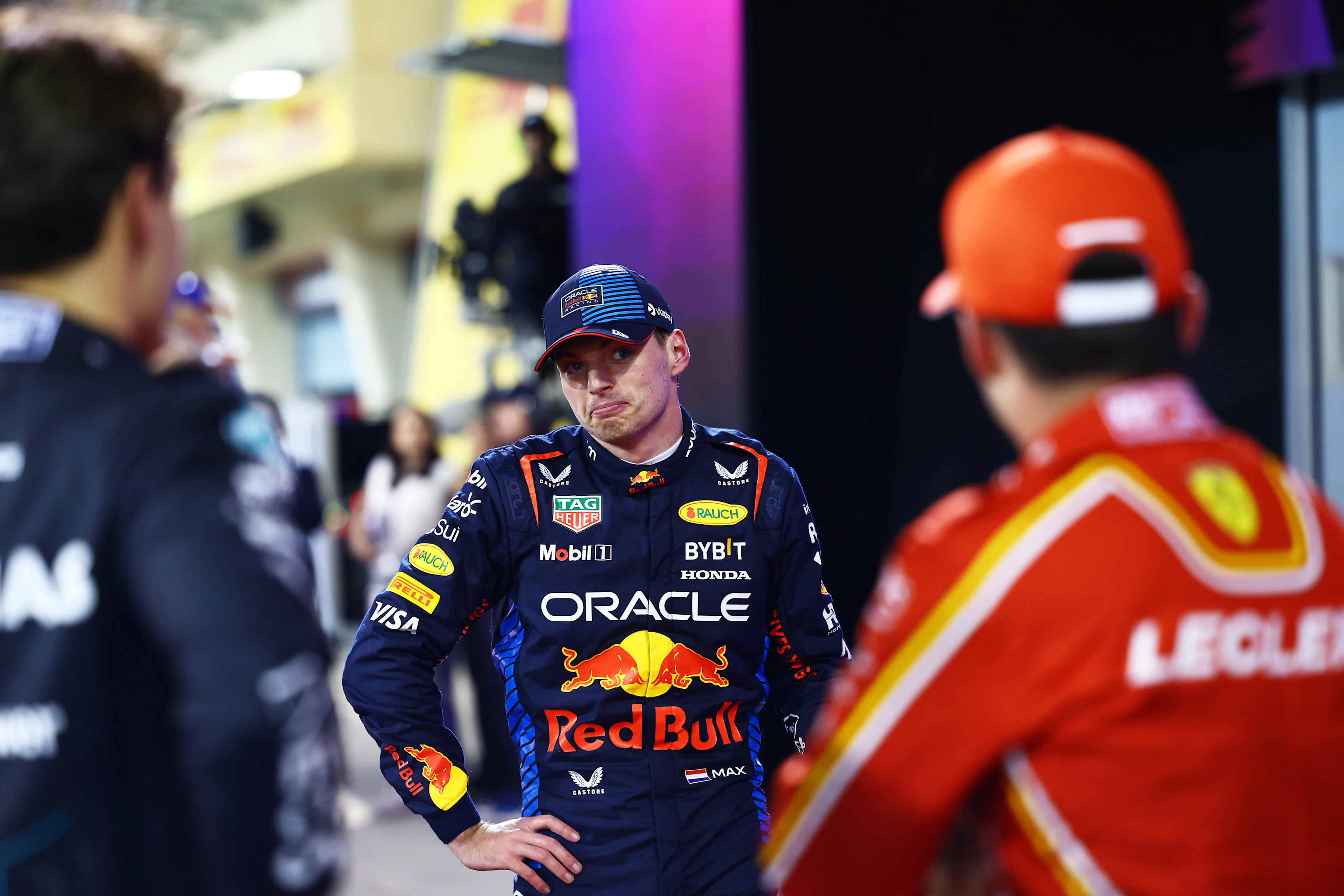 BAHRAIN, BAHRAIN - MARCH 01: Pole position qualifier Max Verstappen of the Netherlands and Oracle Red Bull Racing talks with Second placed qualifier Charles Leclerc of Monaco and Ferrari and Third placed qualifier George Russell of Great Britain and Mercedes in parc ferme during qualifying ahead of the F1 Grand Prix of Bahrain at Bahrain International Circuit on March 01, 2024 in Bahrain, Bahrain. (Photo by Mark Thompson/Getty Images)