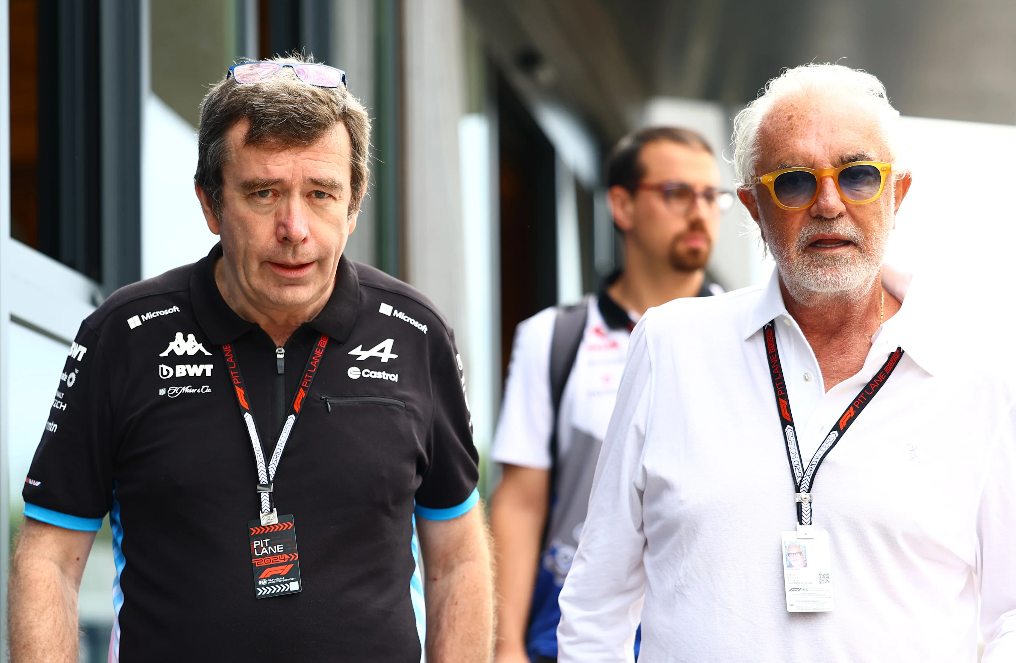 BUDAPEST, HUNGARY - JULY 20: Flavio Briatore, Executive Advisor to Alpine F1, and Bruno Famin, Team Principal of Alpine F1 walk in the Paddock prior to final practice ahead of the F1 Grand Prix of Hungary. (Photo by Mark Thompson/Getty Images)