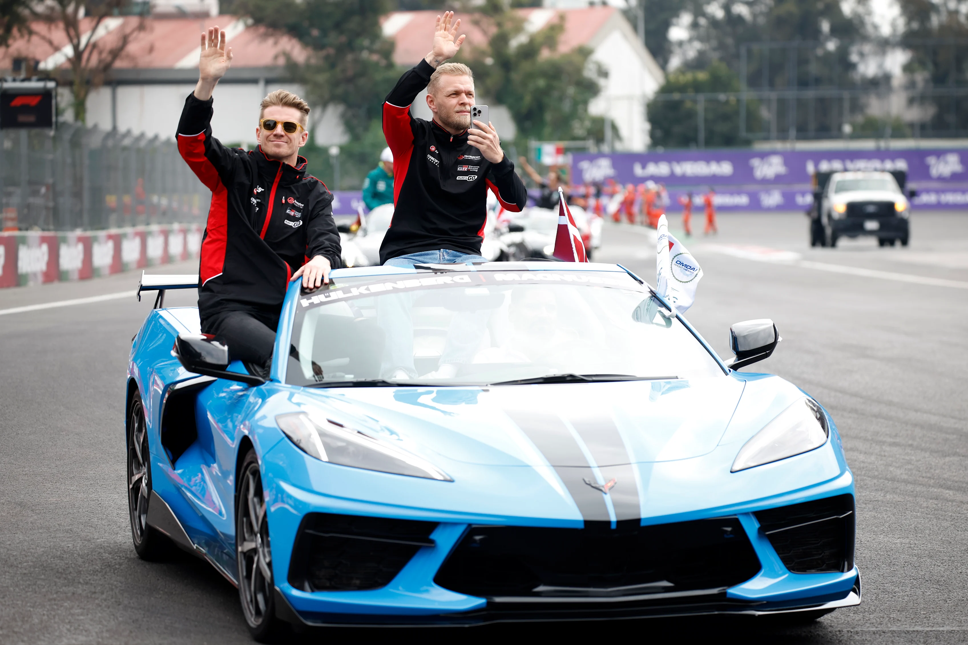 MEXICO CITY, MEXICO - OCTOBER 27: Nico Hulkenberg of Germany and Haas F1 and Kevin Magnussen of Denmark and Haas F1 wave to the crowd on the drivers parade prior to the F1 Grand Prix of Mexico at Autodromo Hermanos Rodriguez on October 27, 2024 in Mexico City, Mexico. (Photo by Chris Graythen/Getty Images)