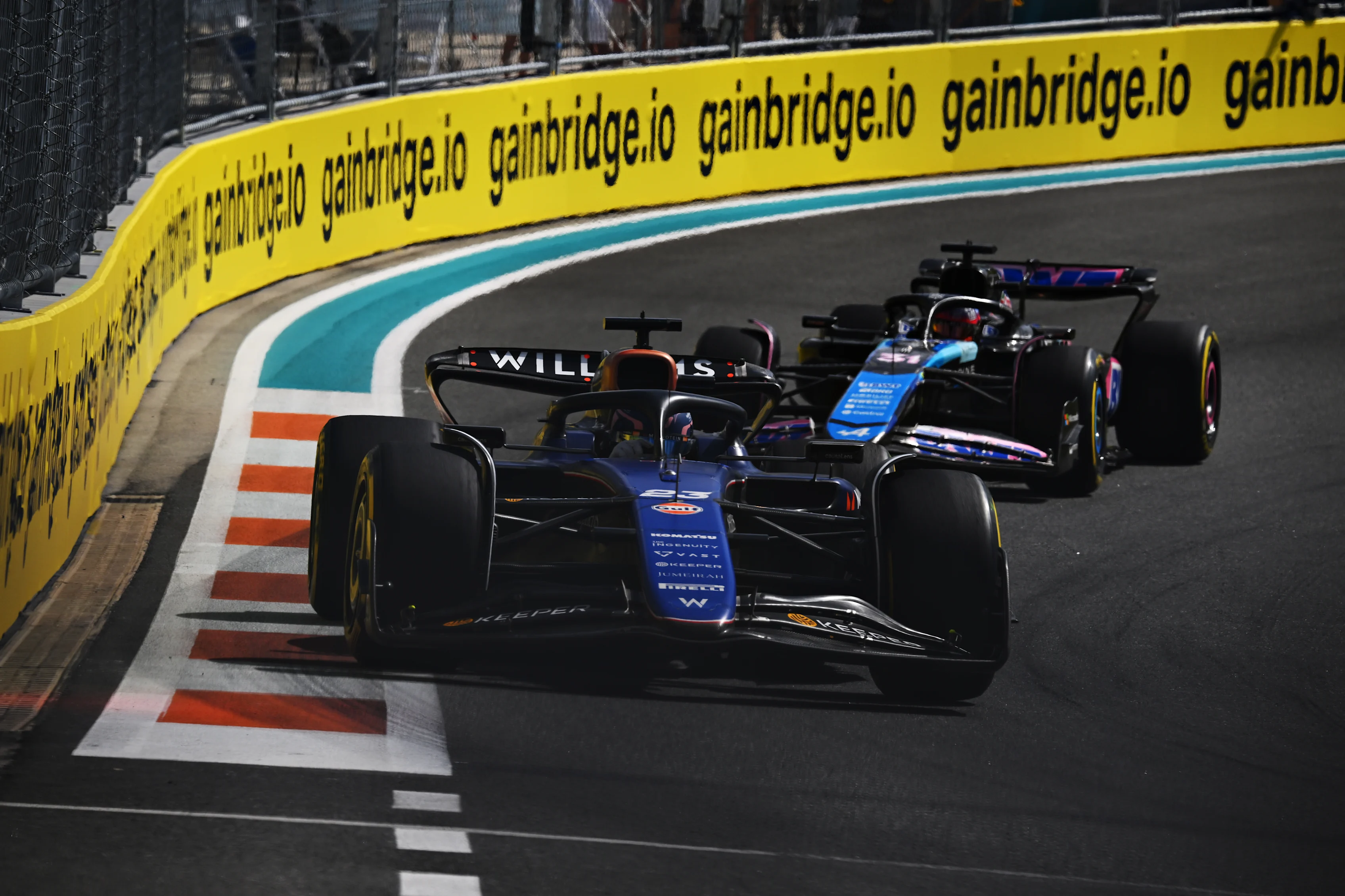MIAMI, FLORIDA - MAY 05: Alexander Albon of Thailand driving the (23) Williams FW46 Mercedes leads Esteban Ocon of France driving the (31) Alpine F1 A524 Renault on track during the F1 Grand Prix of Miami at Miami International Autodrome on May 05, 2024 in Miami, Florida. (Photo by Clive Mason/Getty Images)
