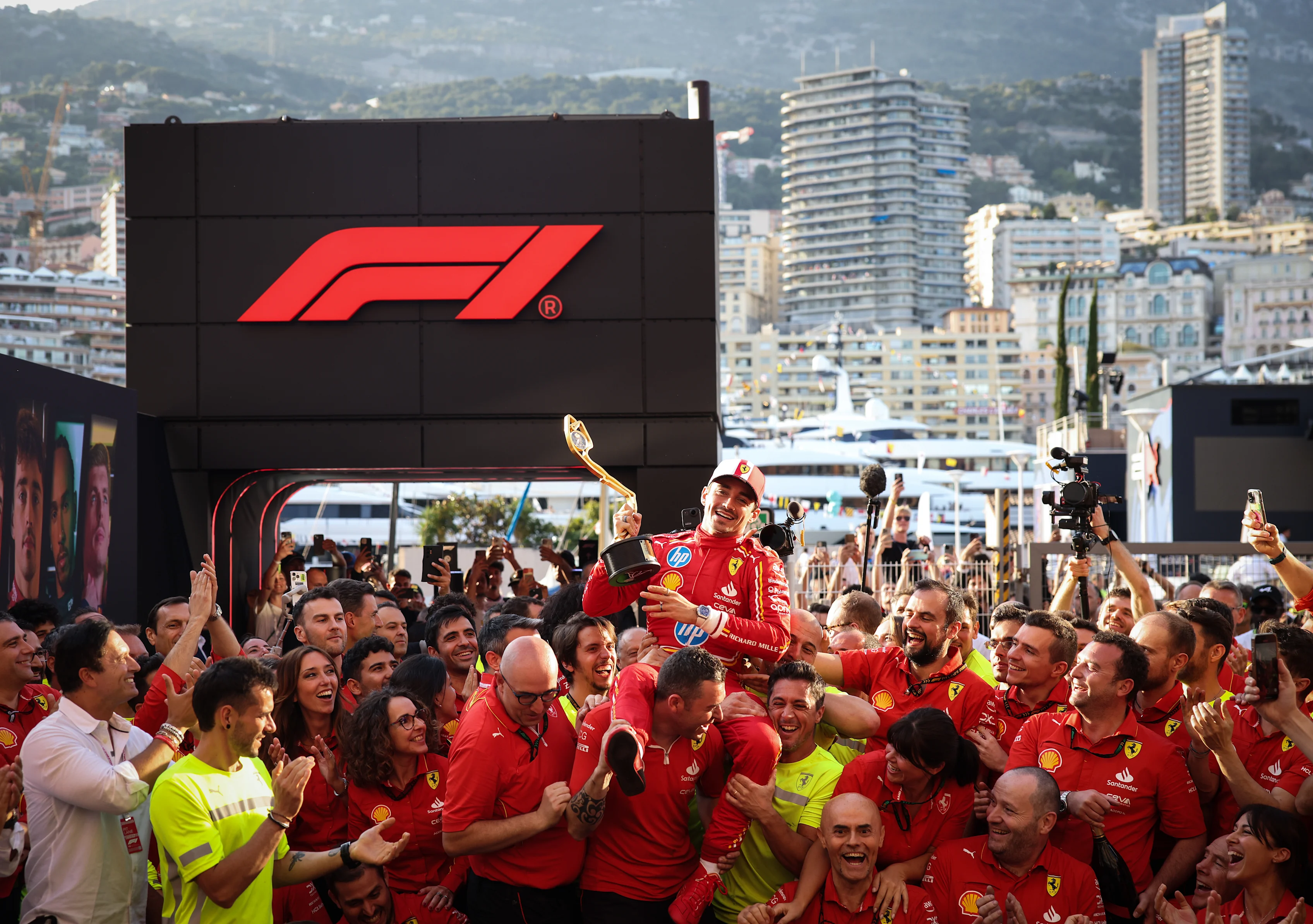 MONTE-CARLO, MONACO - MAY 26: Race winner Charles Leclerc of Monaco and Ferrari celebrates with his team after the F1 Grand Prix of Monaco at Circuit de Monaco on May 26, 2024 in Monte-Carlo, Monaco. (Photo by Ryan Pierse/Getty Images)