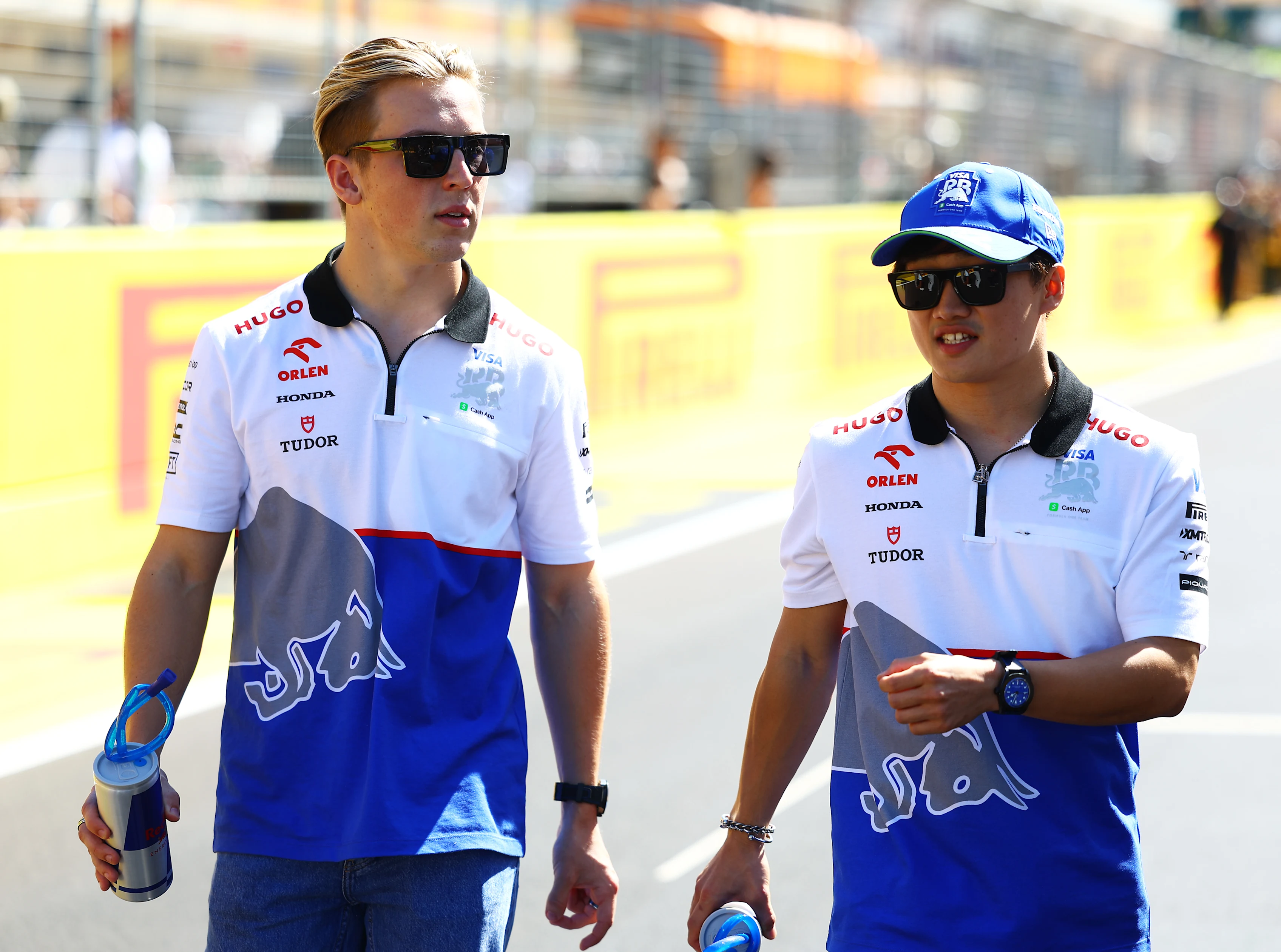 AUSTIN, TEXAS - OCTOBER 20: Liam Lawson and Yuki Tsunoda look on from the drivers parade prior to the F1 Grand Prix of United States at Circuit of The Americas on October 20, 2024 in Austin, Texas. (Photo by Mark Thompson/Getty Images)