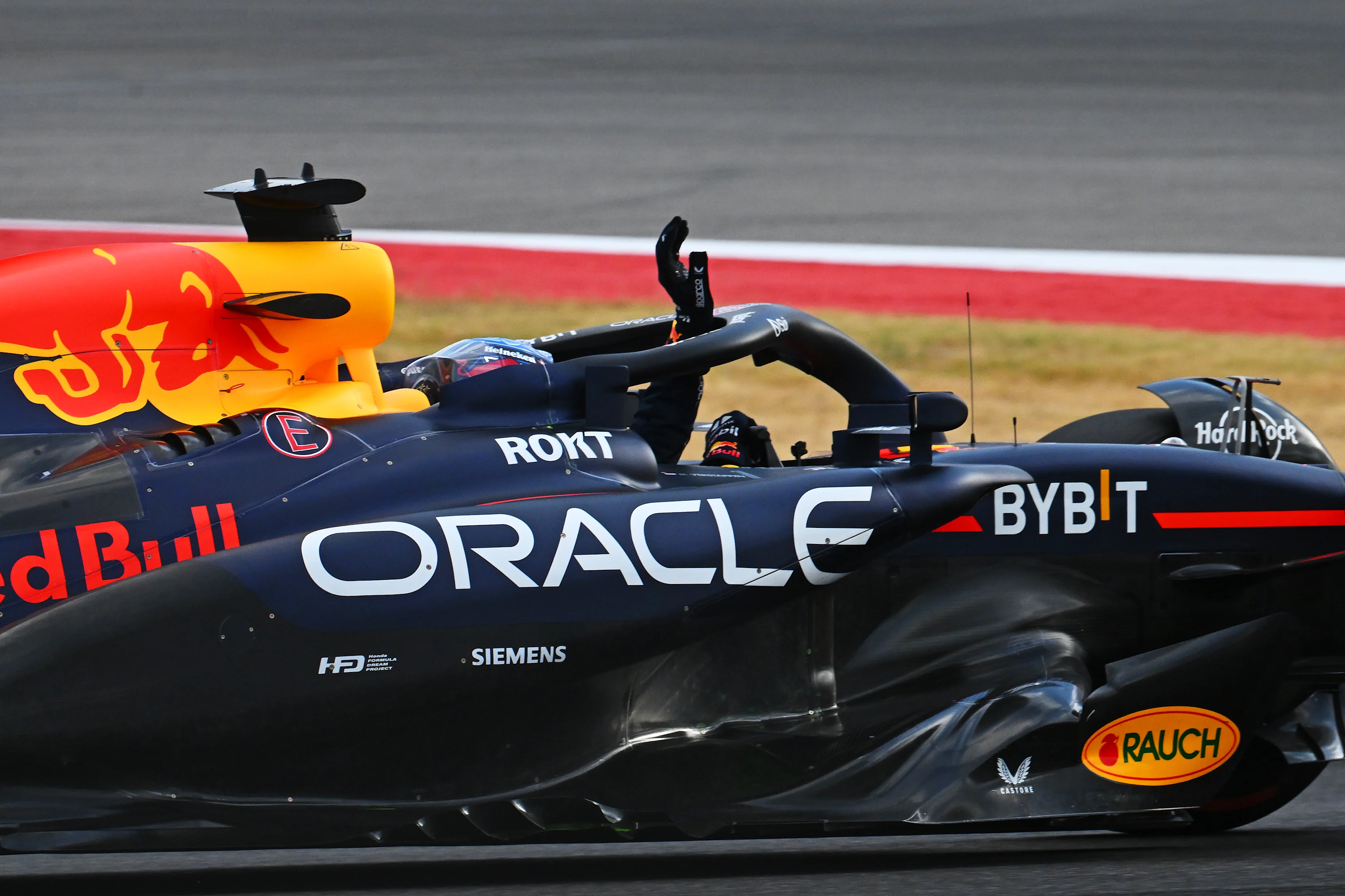 AUSTIN, TEXAS - OCTOBER 18: Sprint Pole qualifier Max Verstappen of the Netherlands driving the (1) Oracle Red Bull Racing RB20 waves to the crowd during Sprint Qualifying ahead of the F1 Grand Prix of United States at Circuit of The Americas on October 18, 2024 in Austin, Texas. (Photo by Mark Sutton/Getty Images)