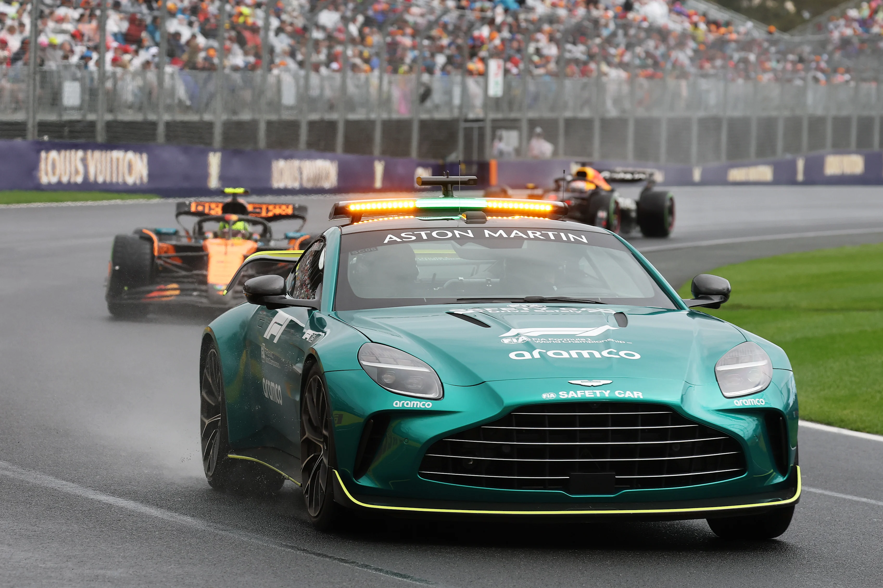 MELBOURNE, AUSTRALIA - MARCH 16: The FIA Safety Car leads Lando Norris of Great Britain driving the