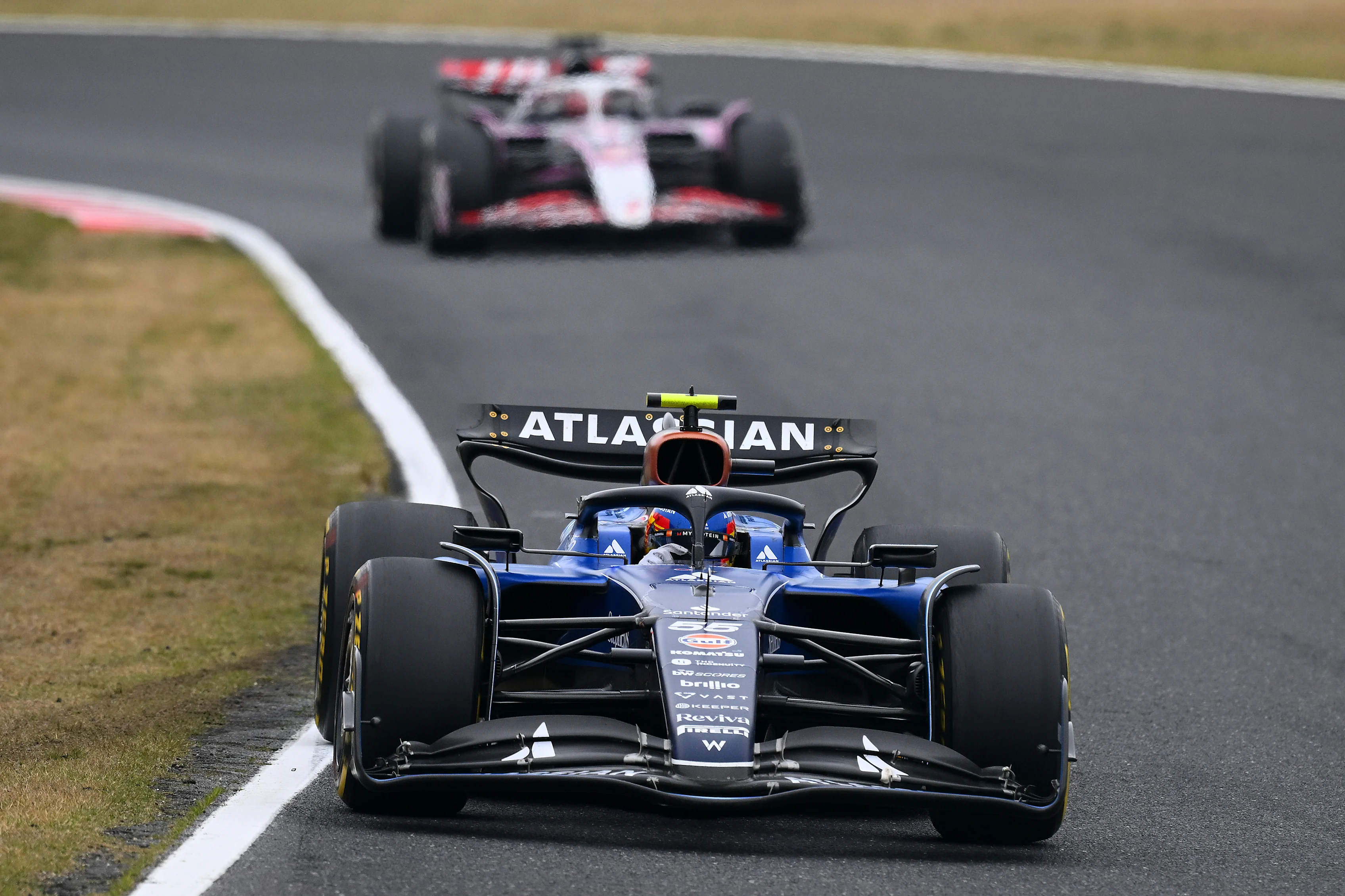SUZUKA, JAPAN - APRIL 06: Carlos Sainz of Spain driving the (55) Williams FW47 Mercedes leads