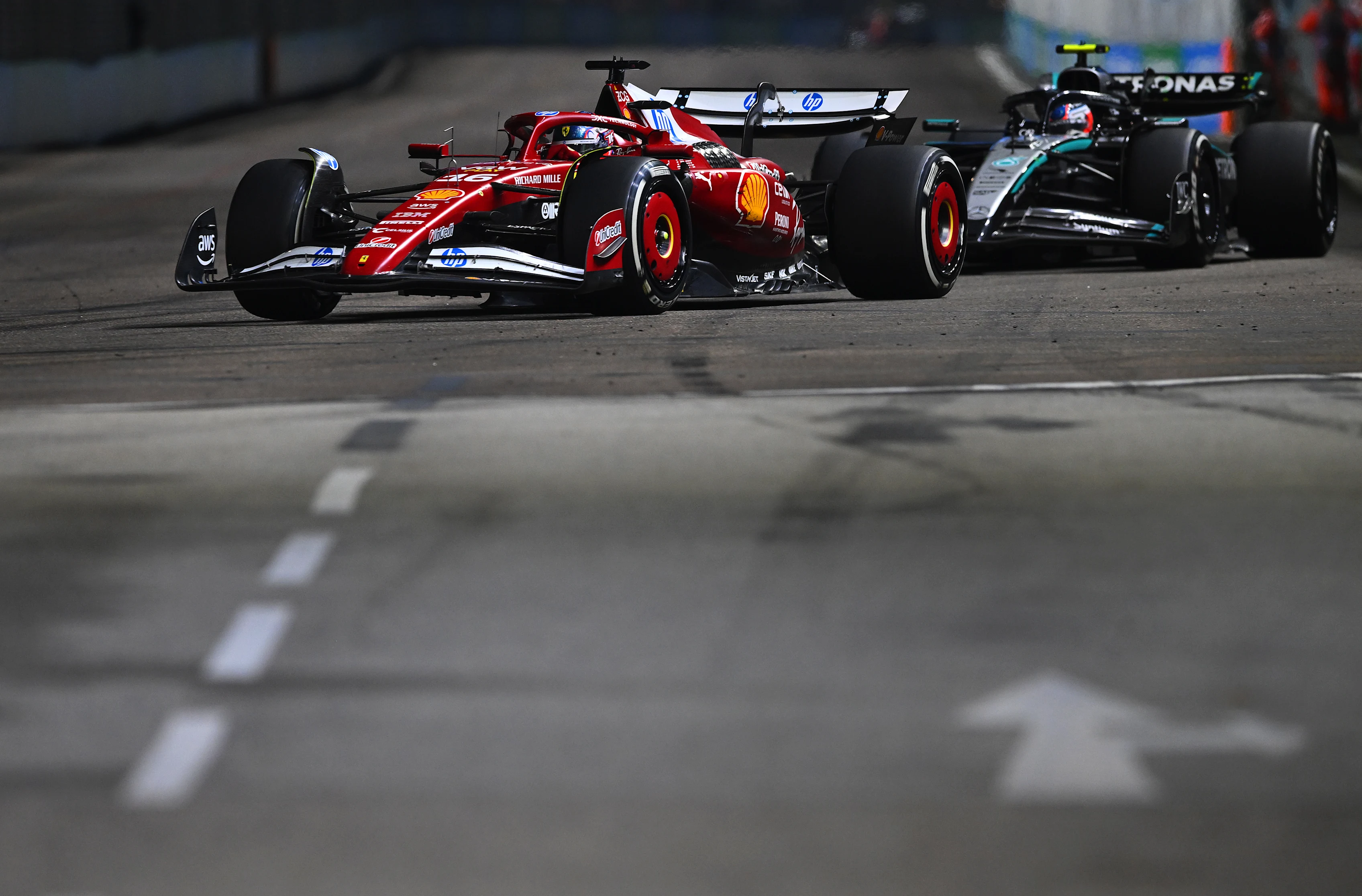 SINGAPORE, SINGAPORE - OCTOBER 05: Charles Leclerc of Monaco driving the (16) Scuderia Ferrari