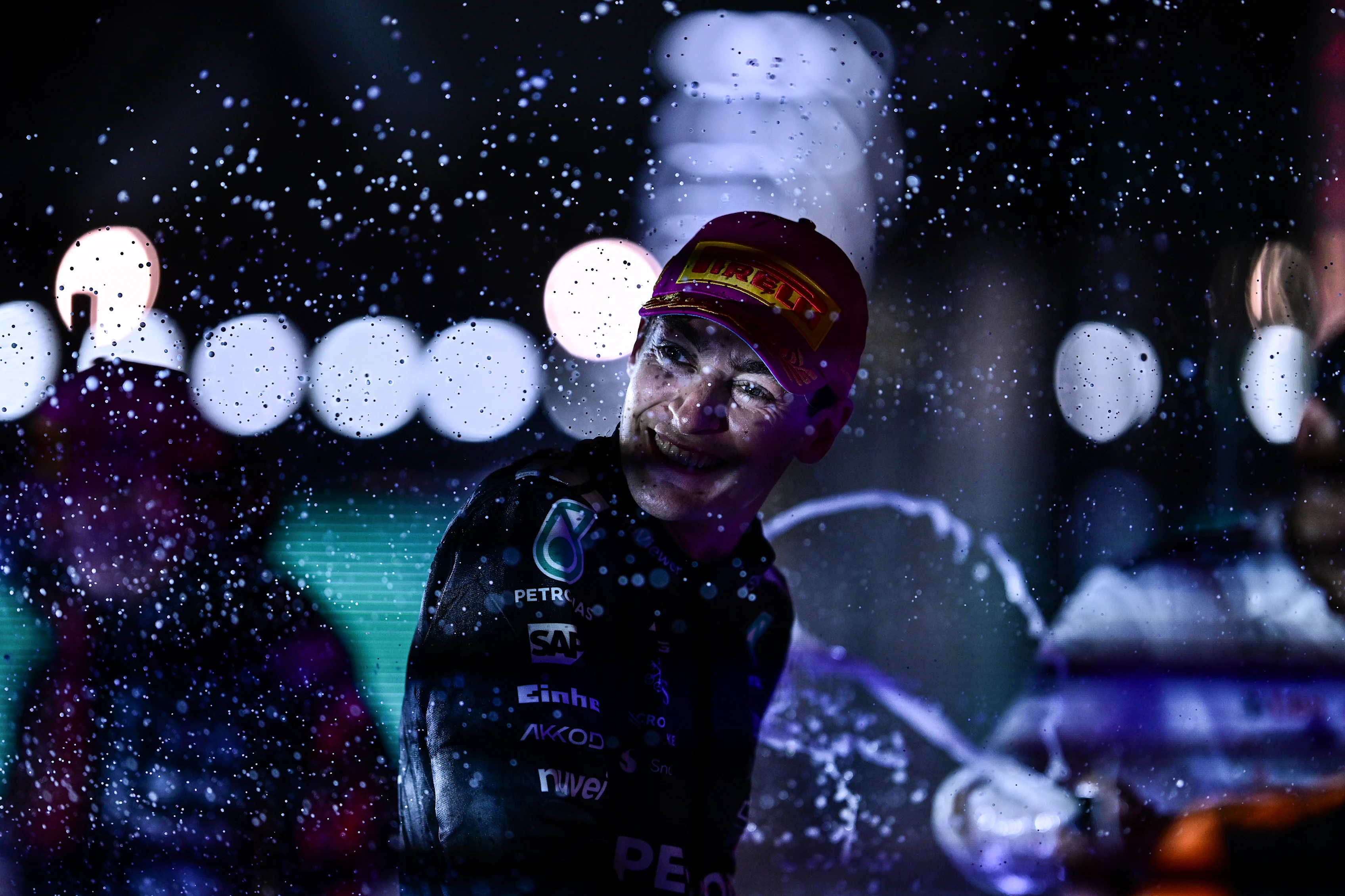 SINGAPORE, SINGAPORE - OCTOBER 05: Race winner George Russell of Great Britain and Mercedes AMG