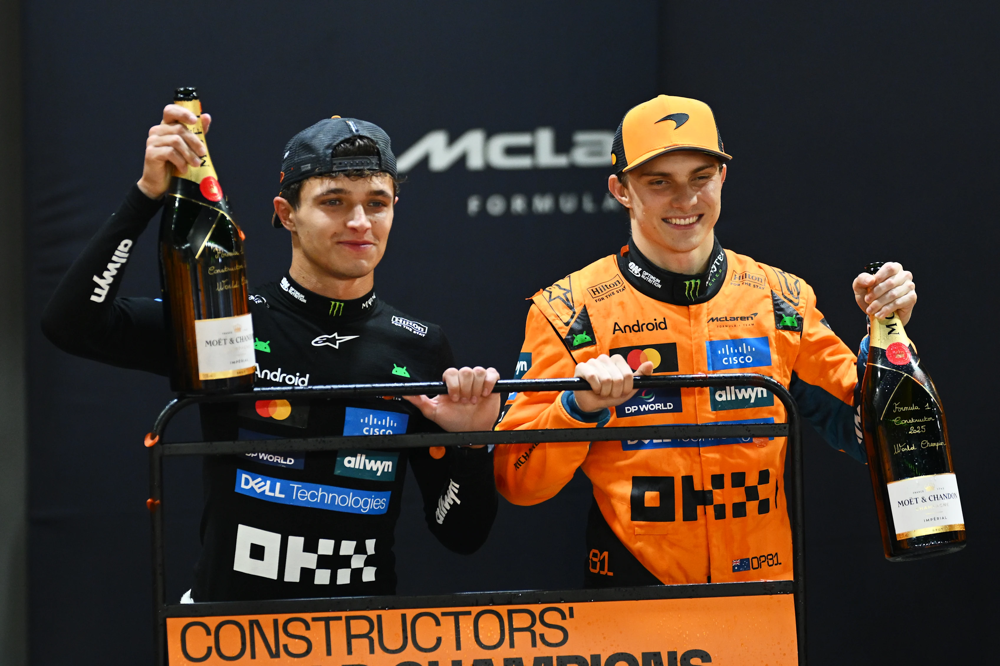 SINGAPORE, SINGAPORE - OCTOBER 05: Lando Norris of Great Britain and McLaren and Oscar Piastri of