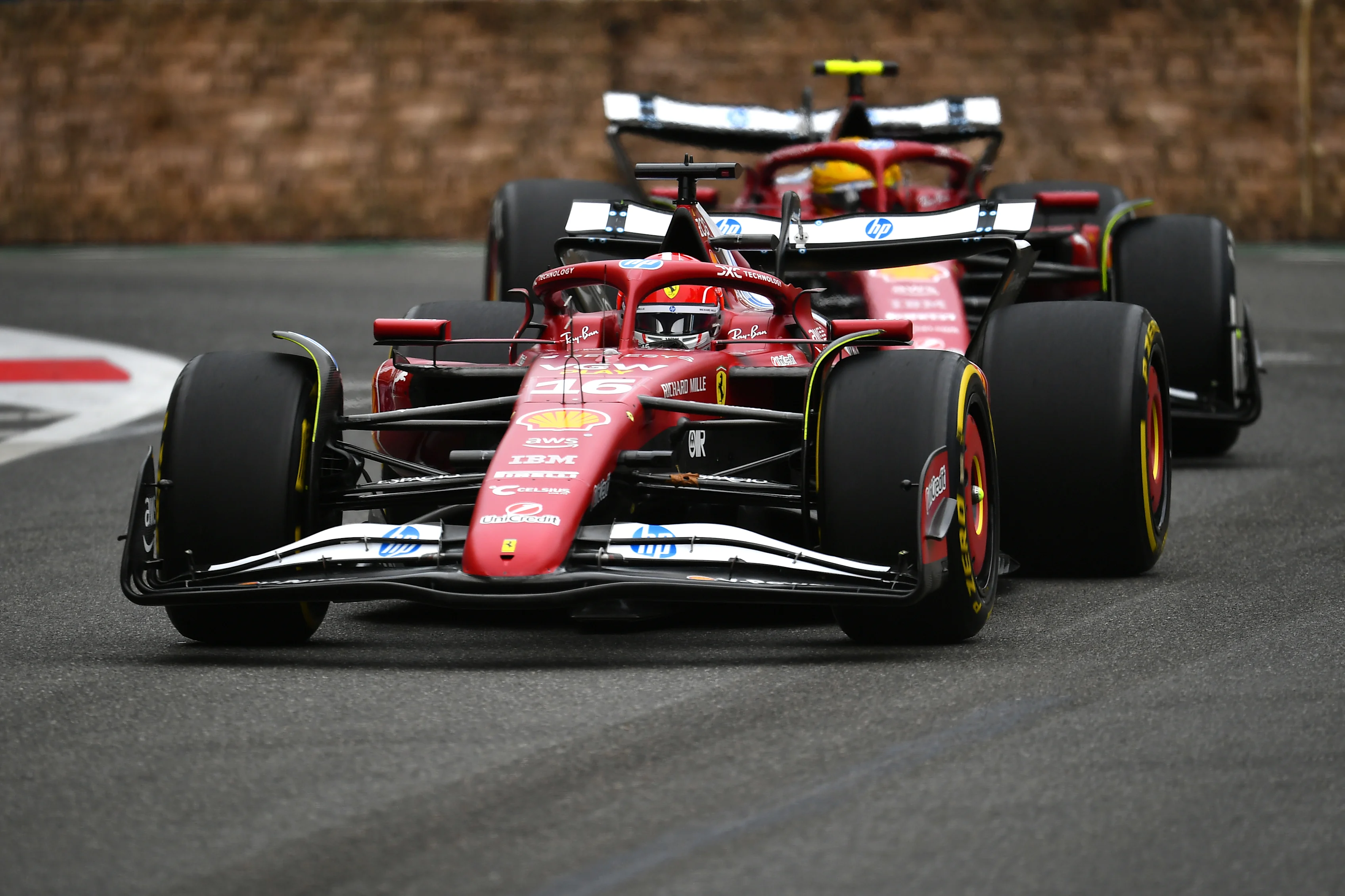 BAKU, AZERBAIJAN - SEPTEMBER 21: Charles Leclerc of Monaco and Scuderia Ferrari and Lewis Hamilton