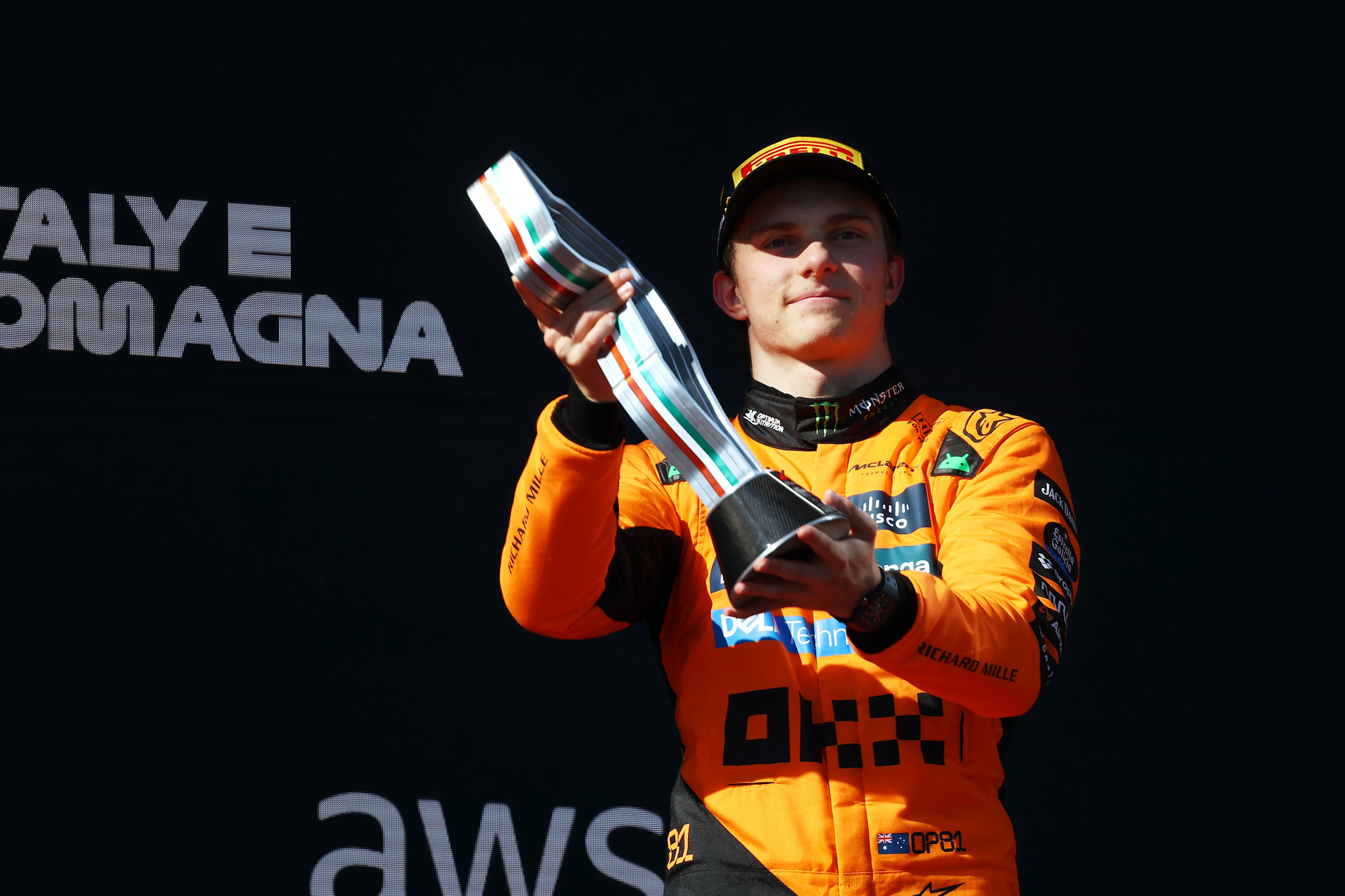 IMOLA, ITALY - MAY 18: Third placed Oscar Piastri of Australia and McLaren lifts his trophy on the