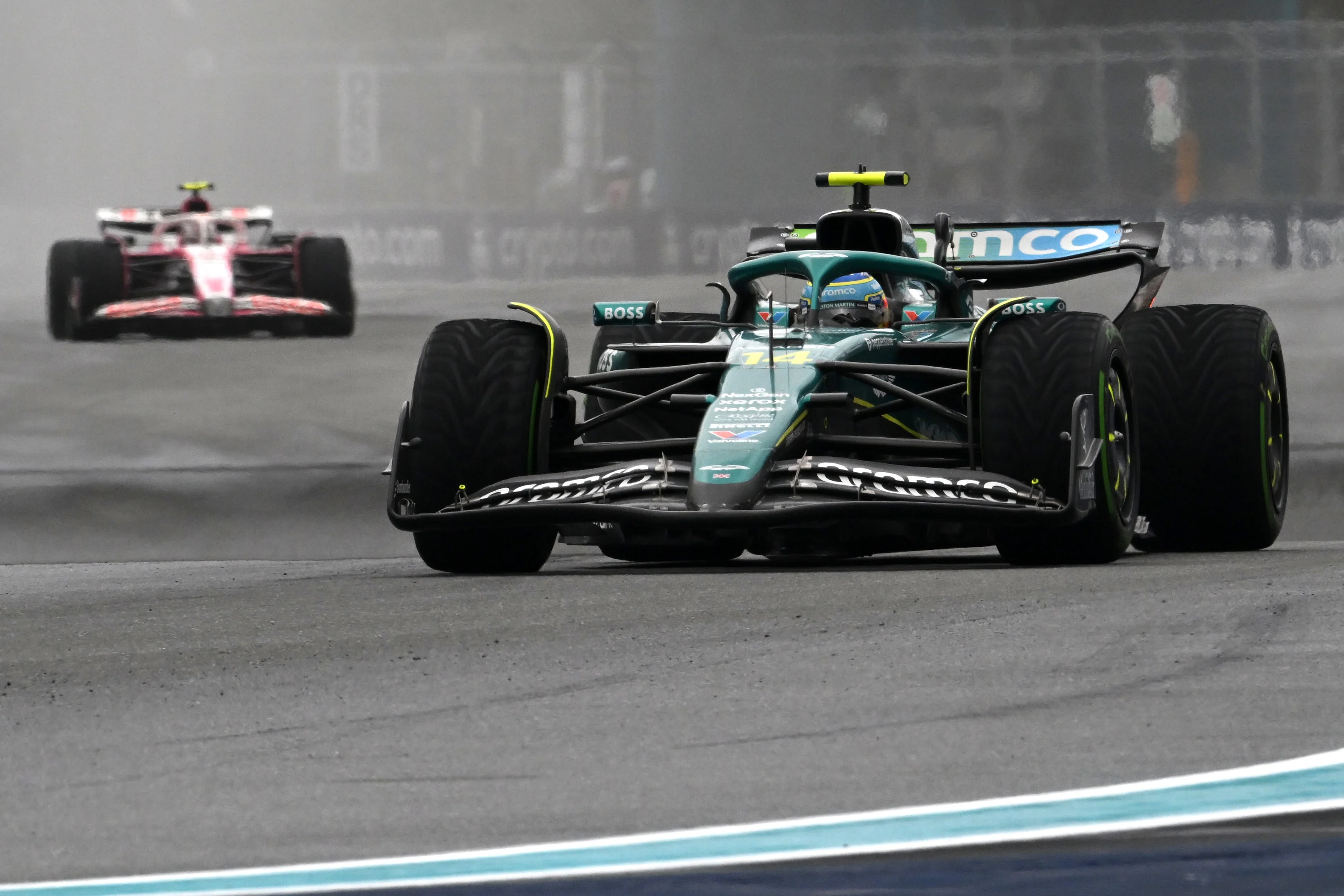 MIAMI, FLORIDA - MAY 03: Fernando Alonso of Spain driving the (14) Aston Martin F1 Team AMR25 Mercedes leads Liam Lawson of New Zealand driving the (30) Visa Cash App Racing Bulls VCARB 02 on track during the Sprint ahead of the F1 Grand Prix of Miami at Miami International Autodrome on May 03, 2025 in Miami, Florida. (Photo by Mark Sutton - Formula 1/Formula 1 via Getty Images)