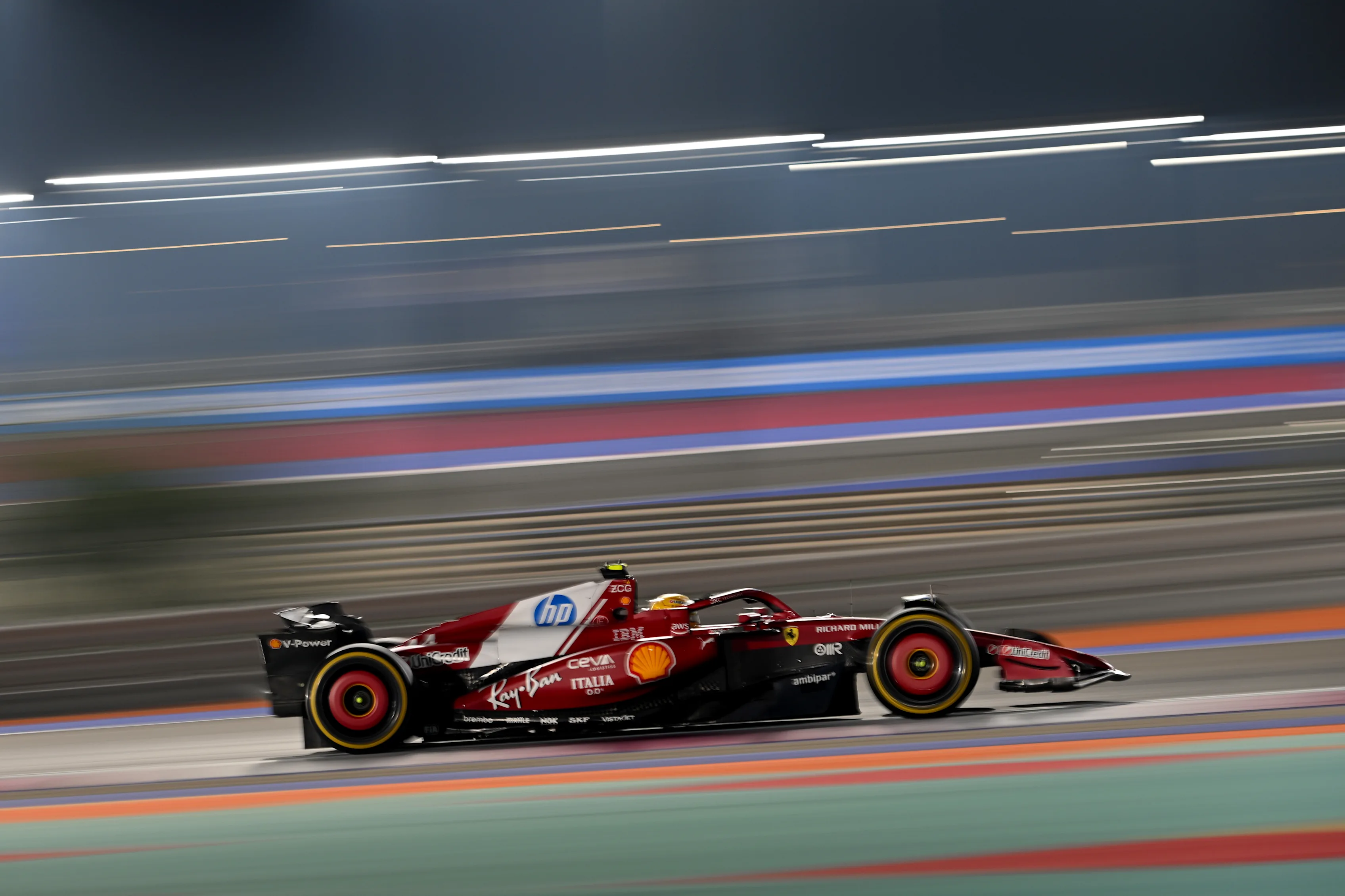 LUSAIL CITY, QATAR - NOVEMBER 30: Lewis Hamilton of Great Britain driving the (44) Scuderia Ferrari