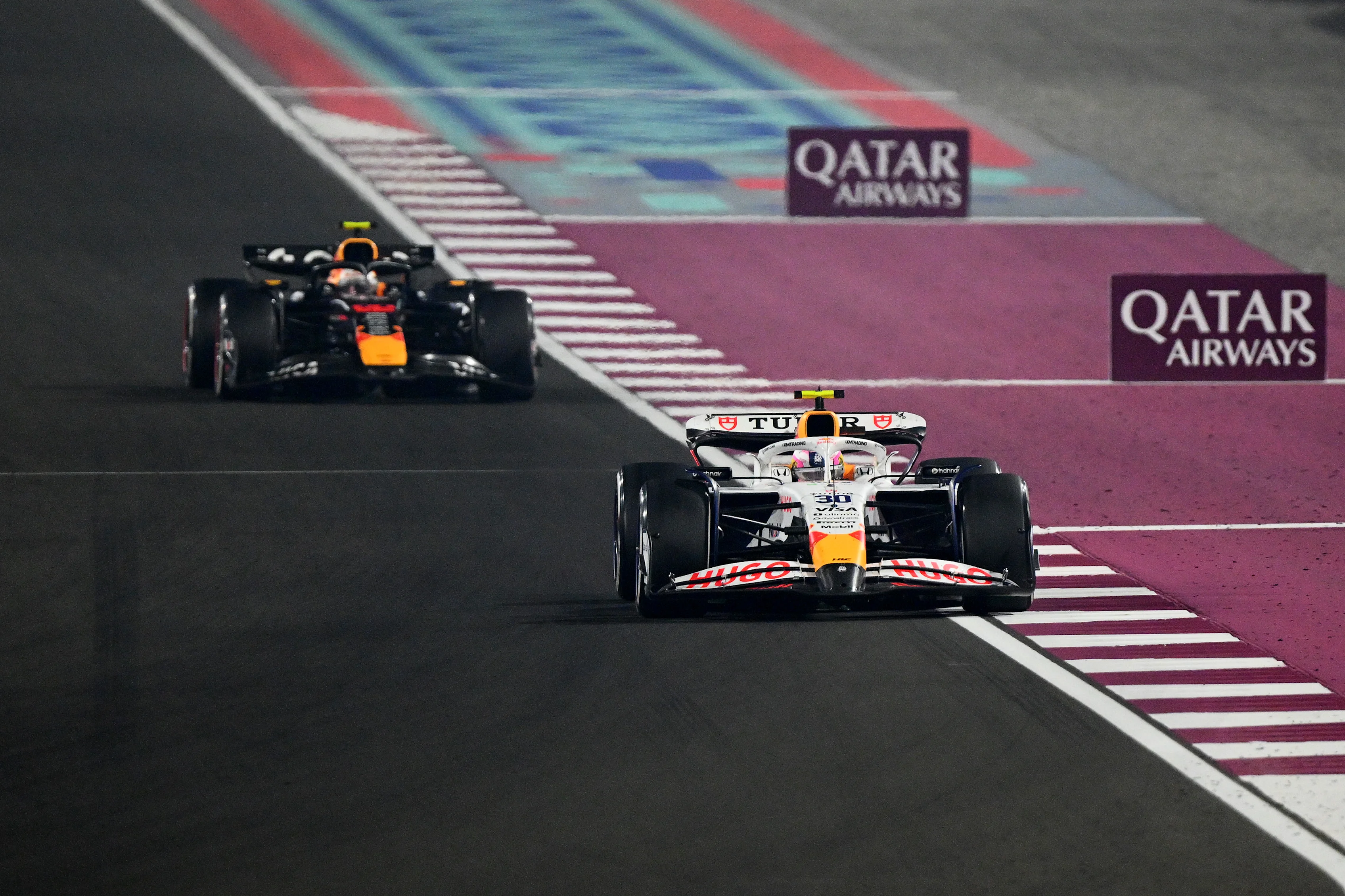 LUSAIL CITY, QATAR - NOVEMBER 30: Liam Lawson of New Zealand driving the (30) Visa Cash App Racing