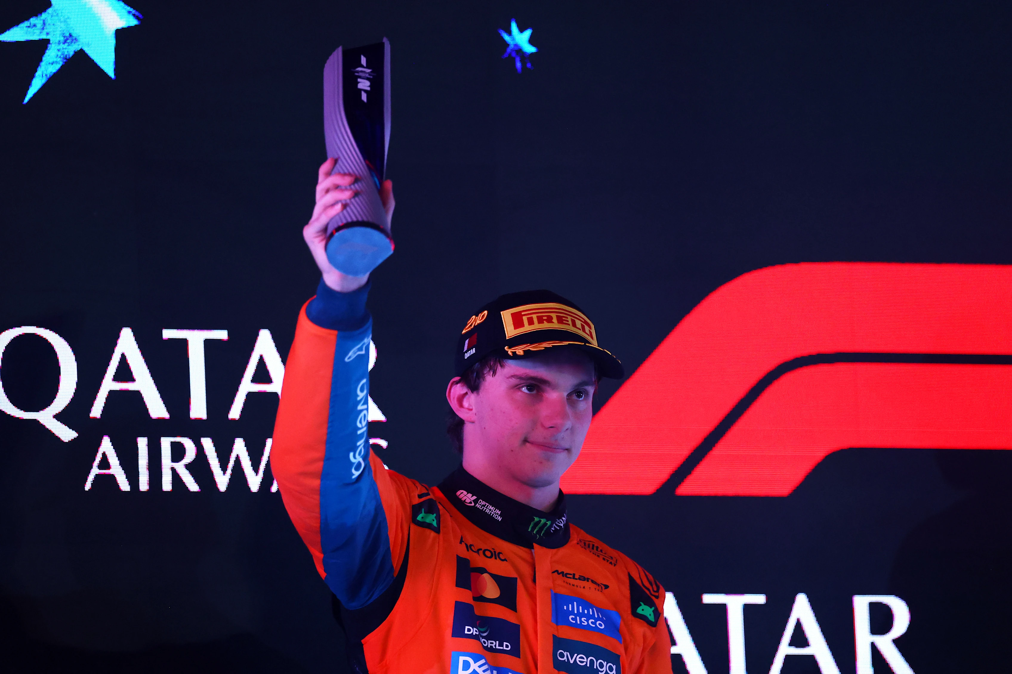 LUSAIL CITY, QATAR - NOVEMBER 30: Second placed Oscar Piastri of Australia and McLaren lifts his