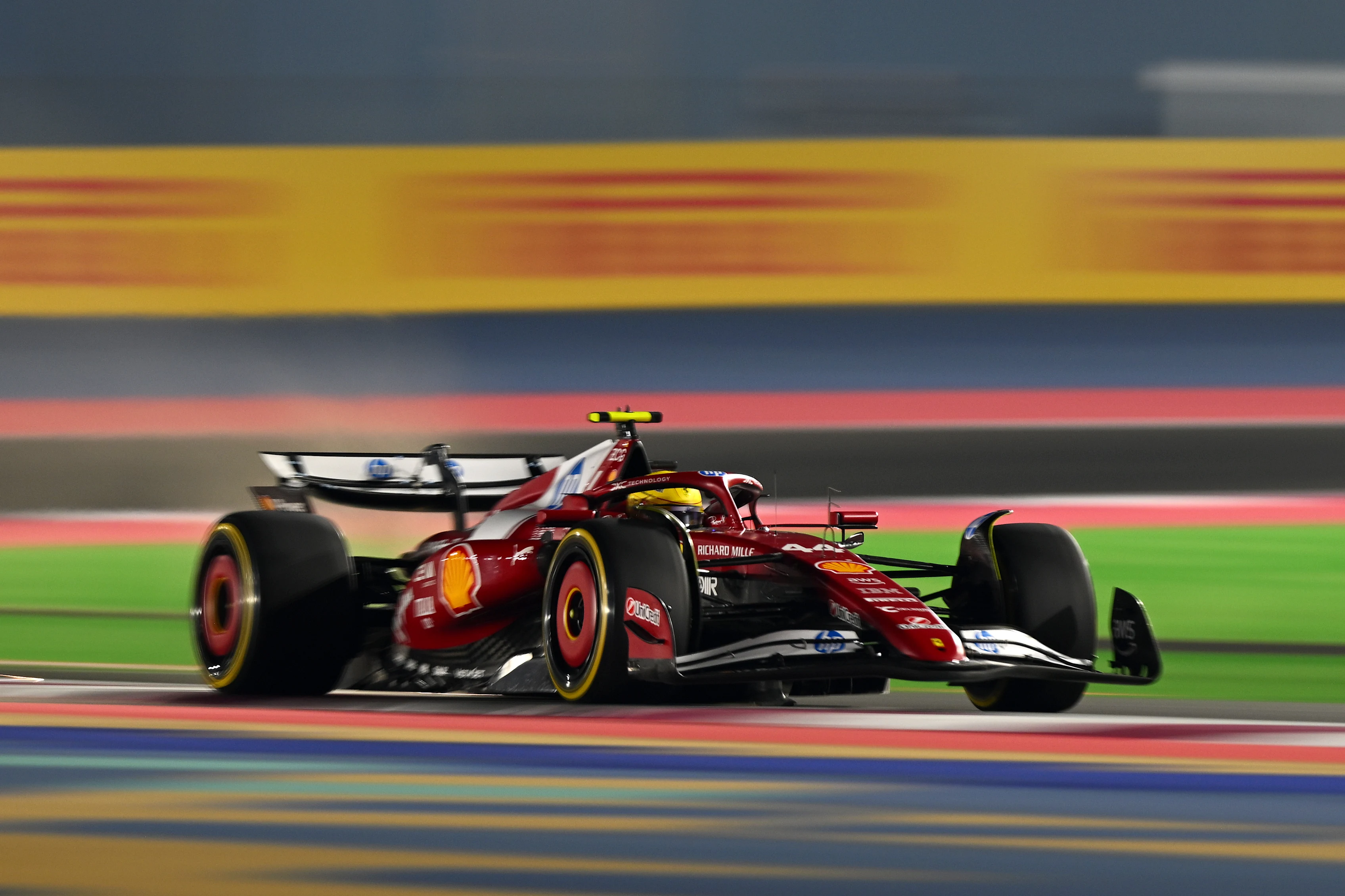 LUSAIL CITY, QATAR - NOVEMBER 28: Lewis Hamilton of Great Britain driving the (44) Scuderia Ferrari