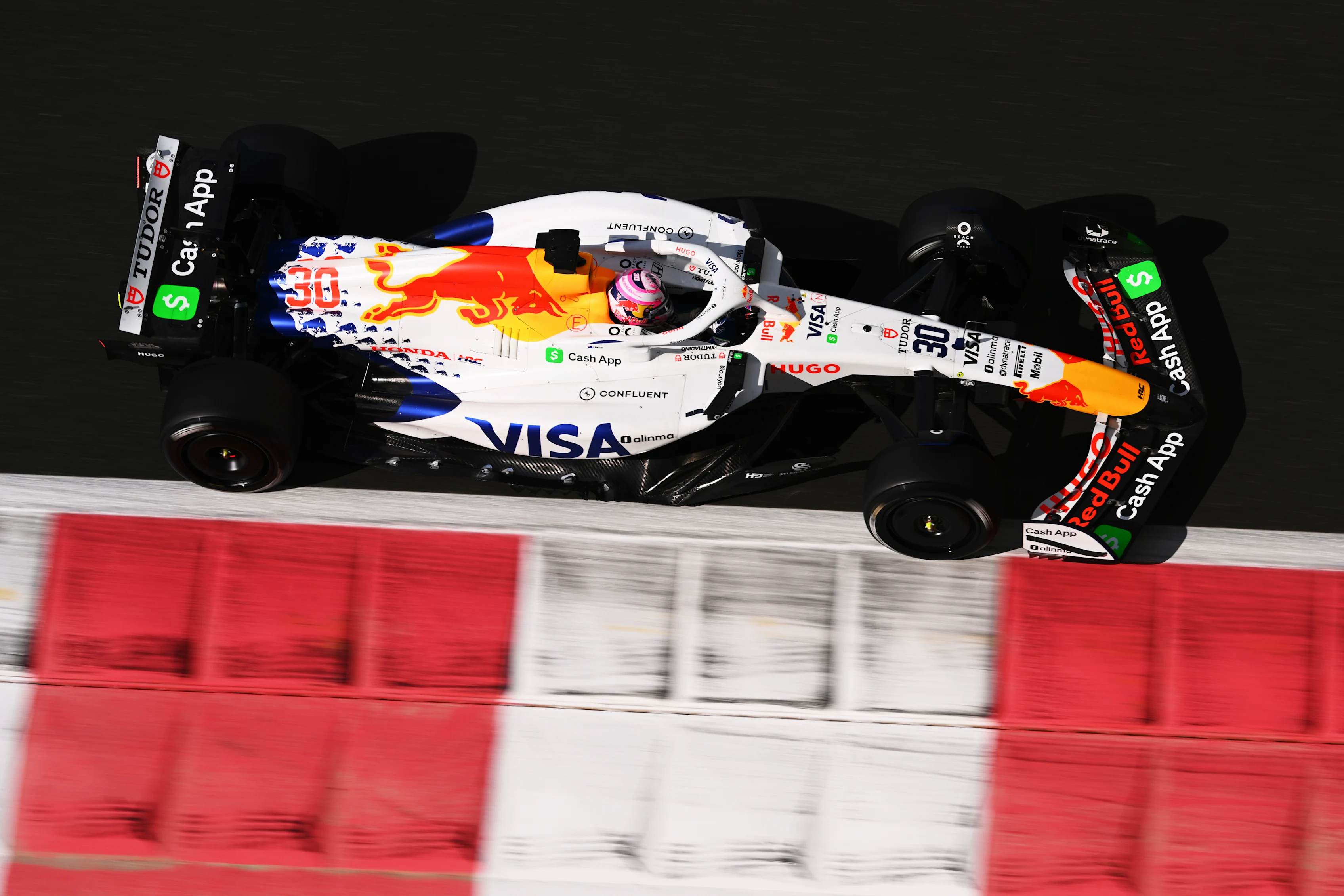 ABU DHABI, UNITED ARAB EMIRATES - DECEMBER 09: Liam Lawson of New Zealand driving the (30) Visa