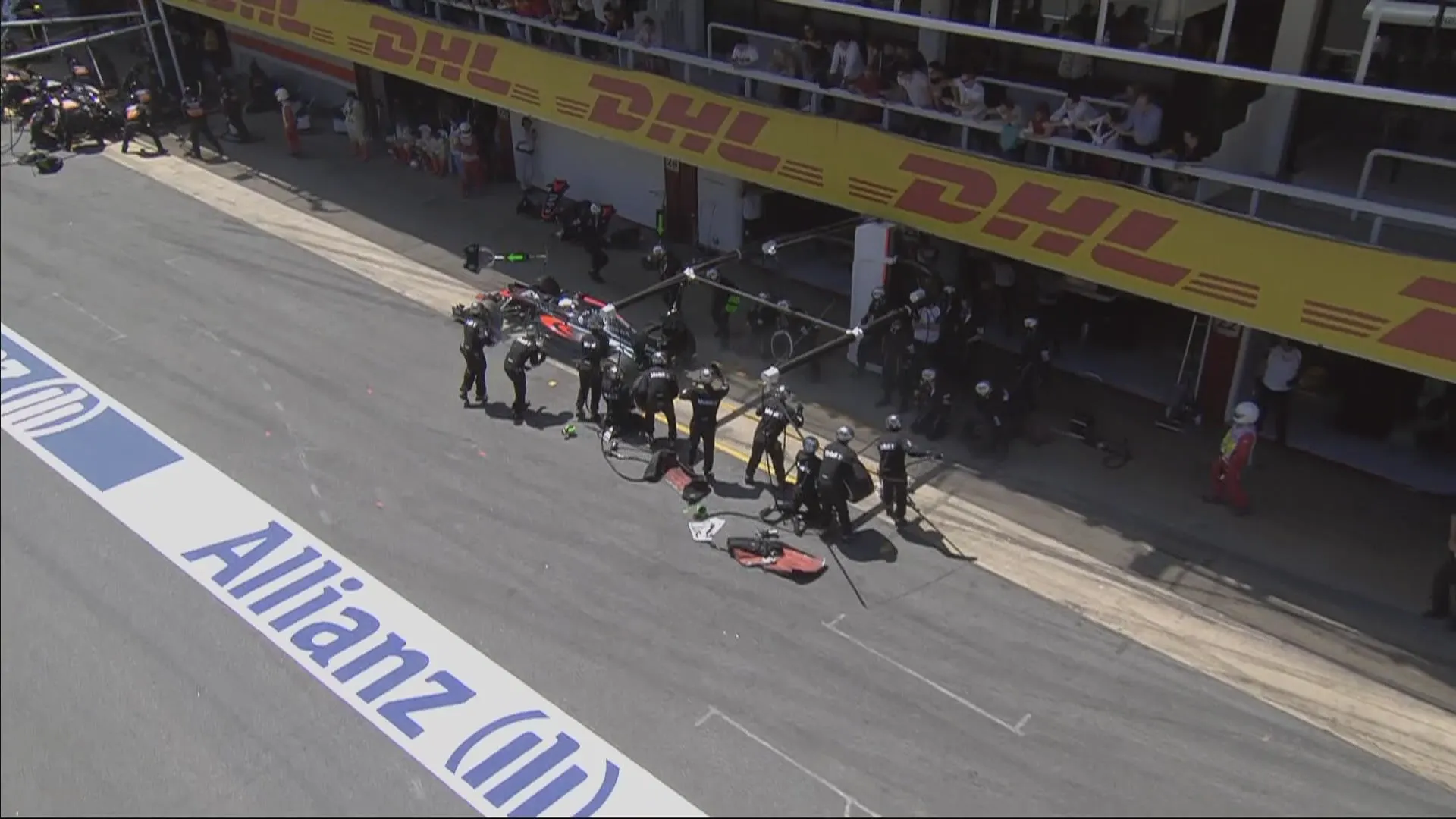 Fernando Alonso overshoots his pit box due to brake failure and retires