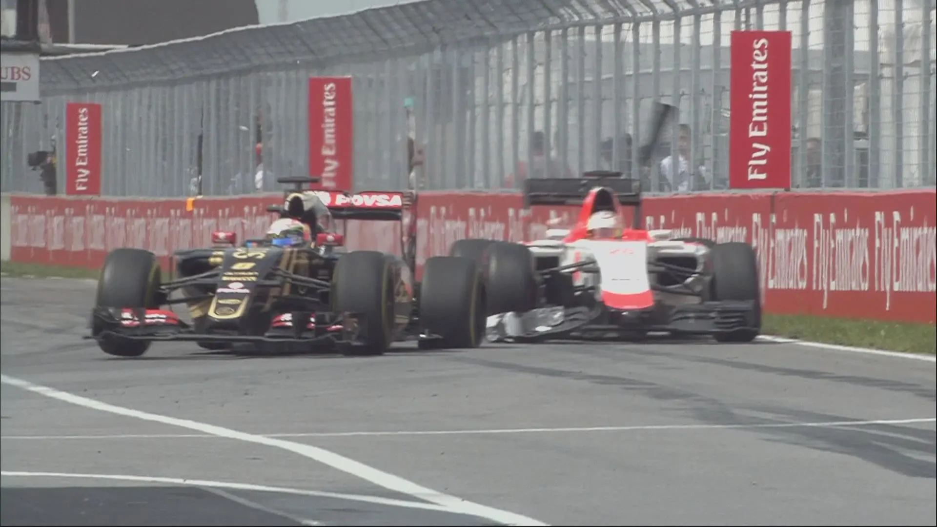 Romain Grosjean cuts across Will Stevens and punctures his rear left tyre