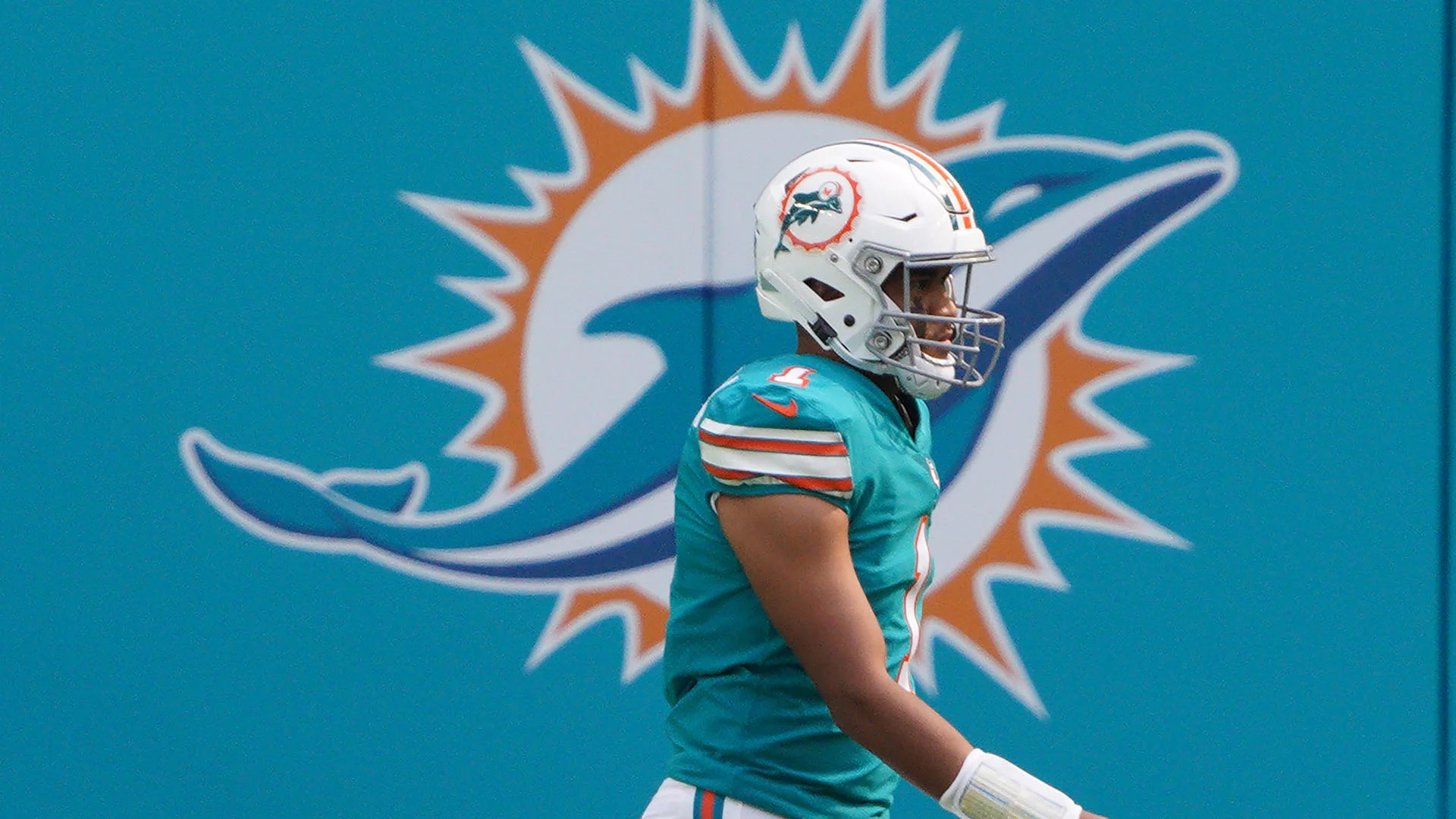 MIAMI GARDENS, FLORIDA - DECEMBER 20: Tua Tagovailoa #1 of the Miami Dolphins in action against the