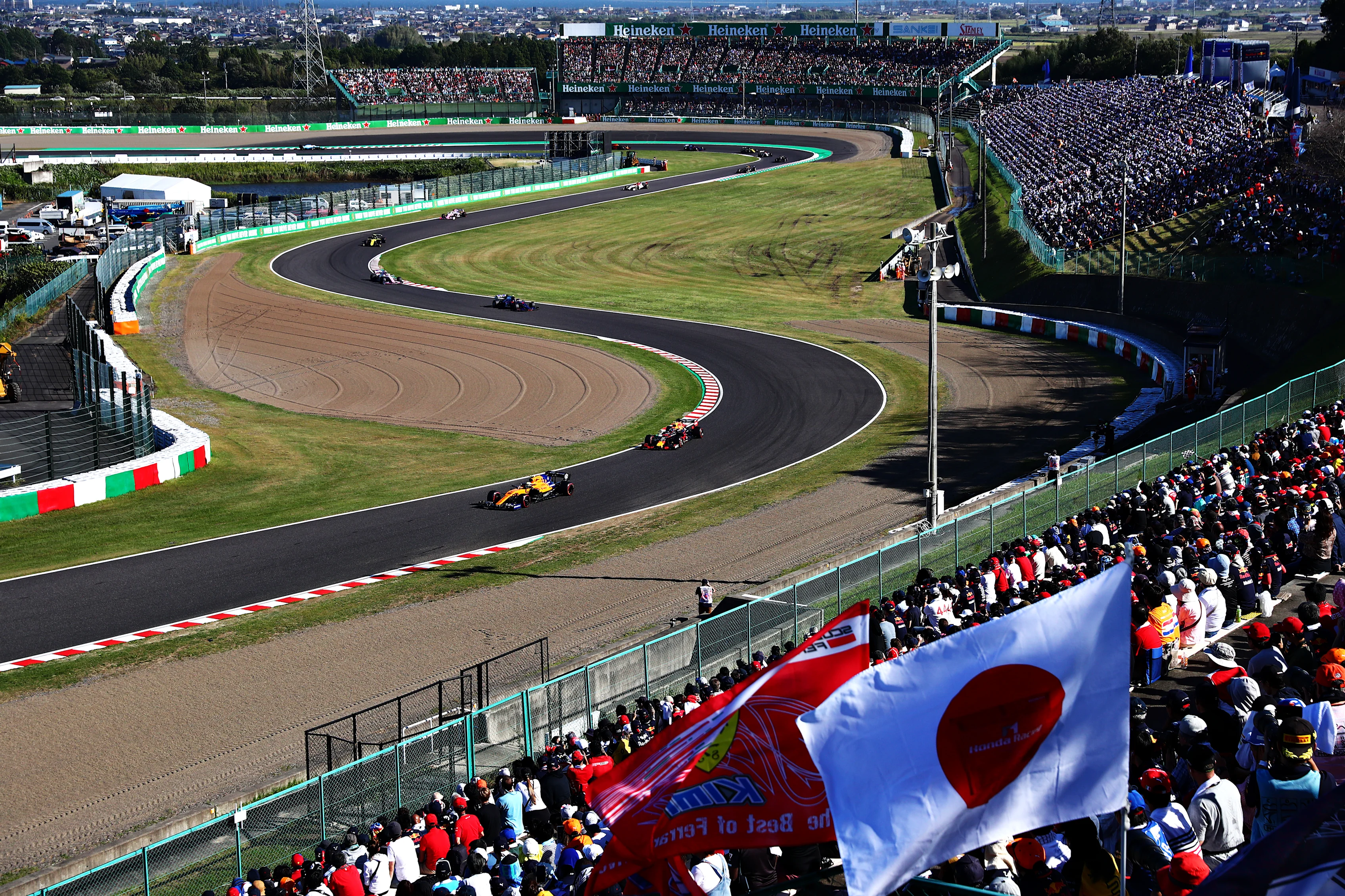 SUZUKA, JAPAN - OCTOBER 13: Lando Norris of Great Britain driving the (4) McLaren F1 Team MCL34