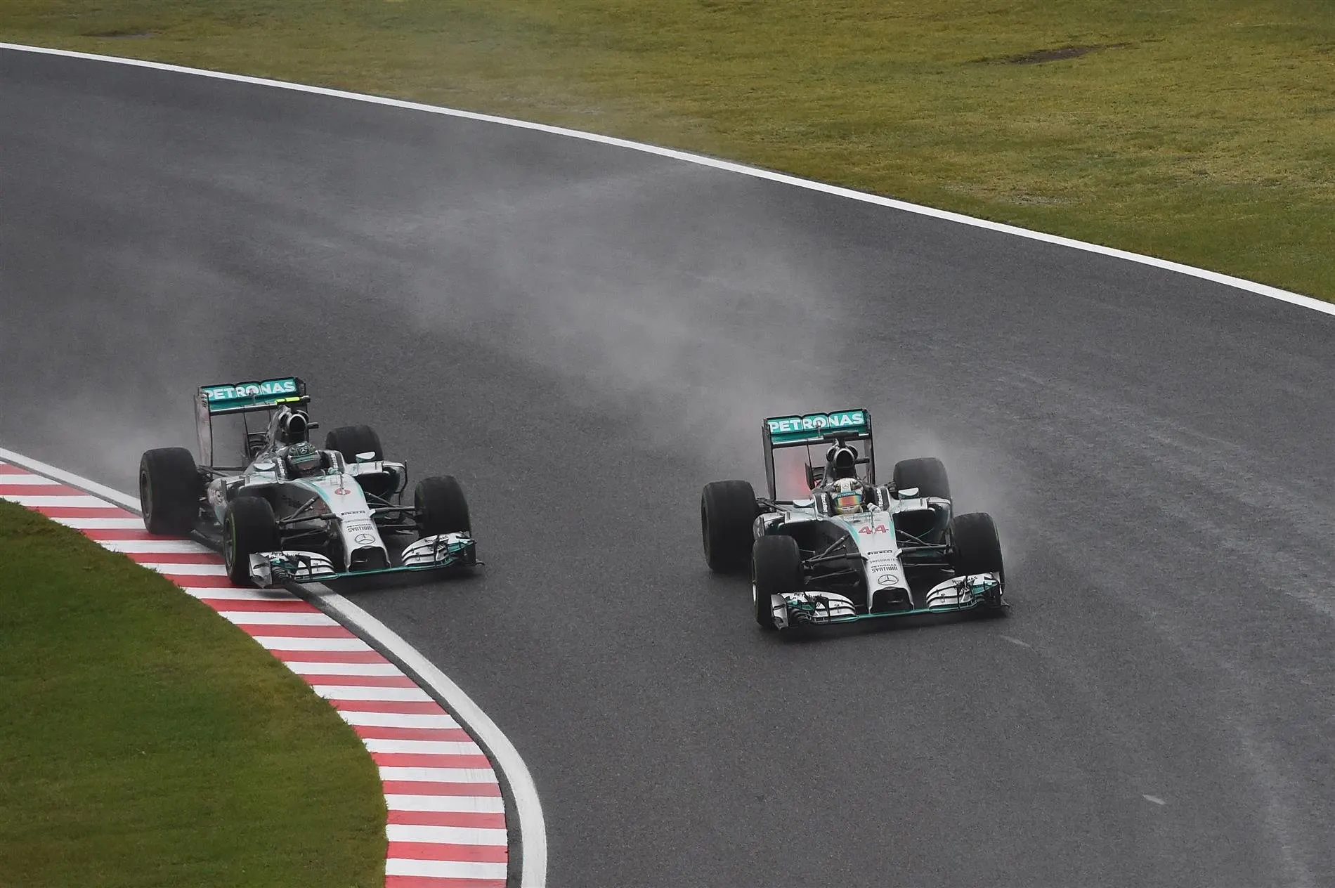 Lewis Hamilton (GBR) Mercedes AMG F1 W05 overtakes Nico Rosberg (GER) Mercedes AMG F1 W05 for the lead of the race. Formula One World Championship, Rd15, Japanese Grand Prix, Race, Suzuka, Japan, Sunday, 5 October 2014 © Sutton Images. No reproduction without permission