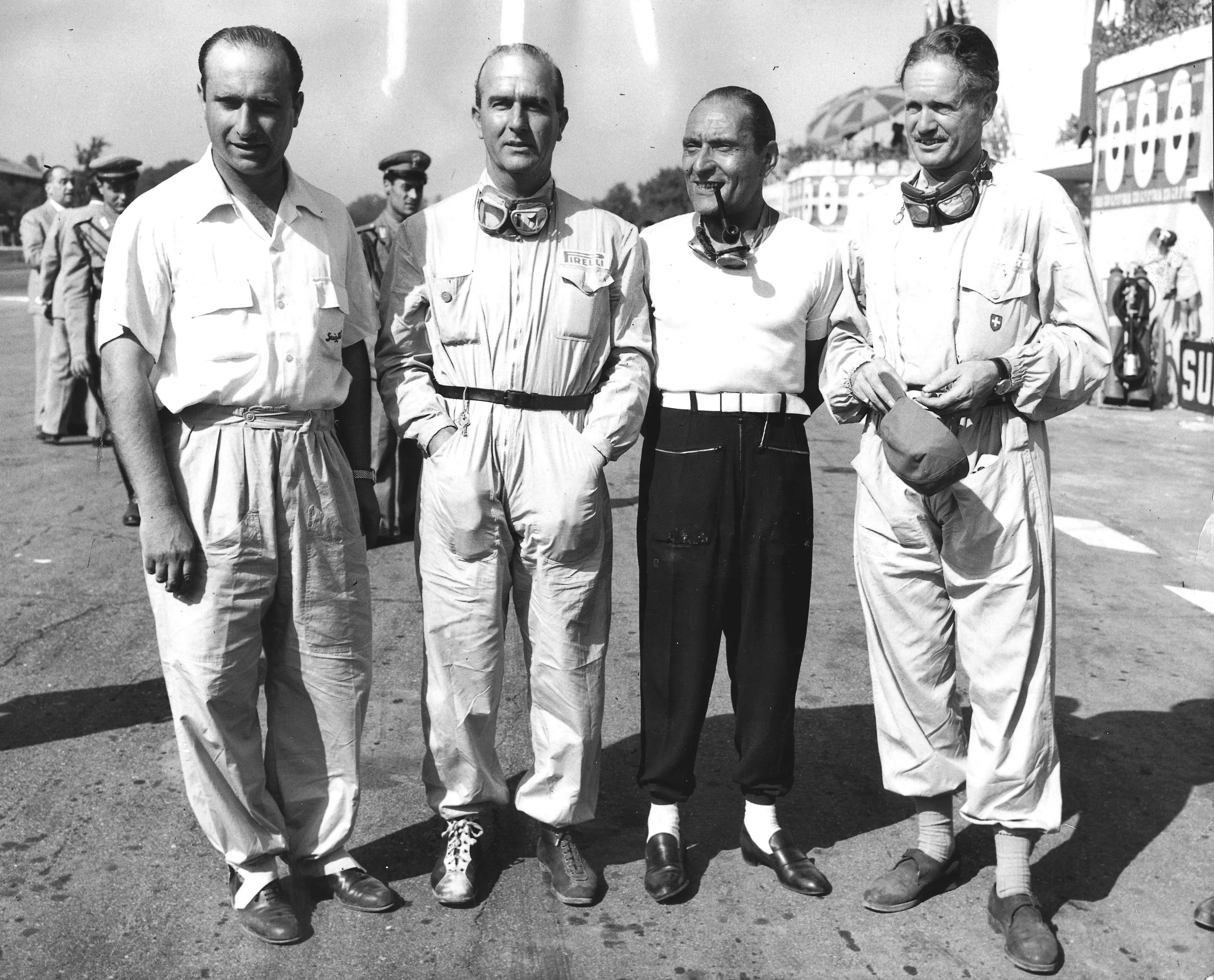 The Alfa Romeo team before the start. (L-R) Juan Manuel Fangio, Giuseppe Farina, Felice Bonetto and Emmanuel de Graffenried. 1950 Italian Grand Prix. Monza, Italy. © LAT Photographic