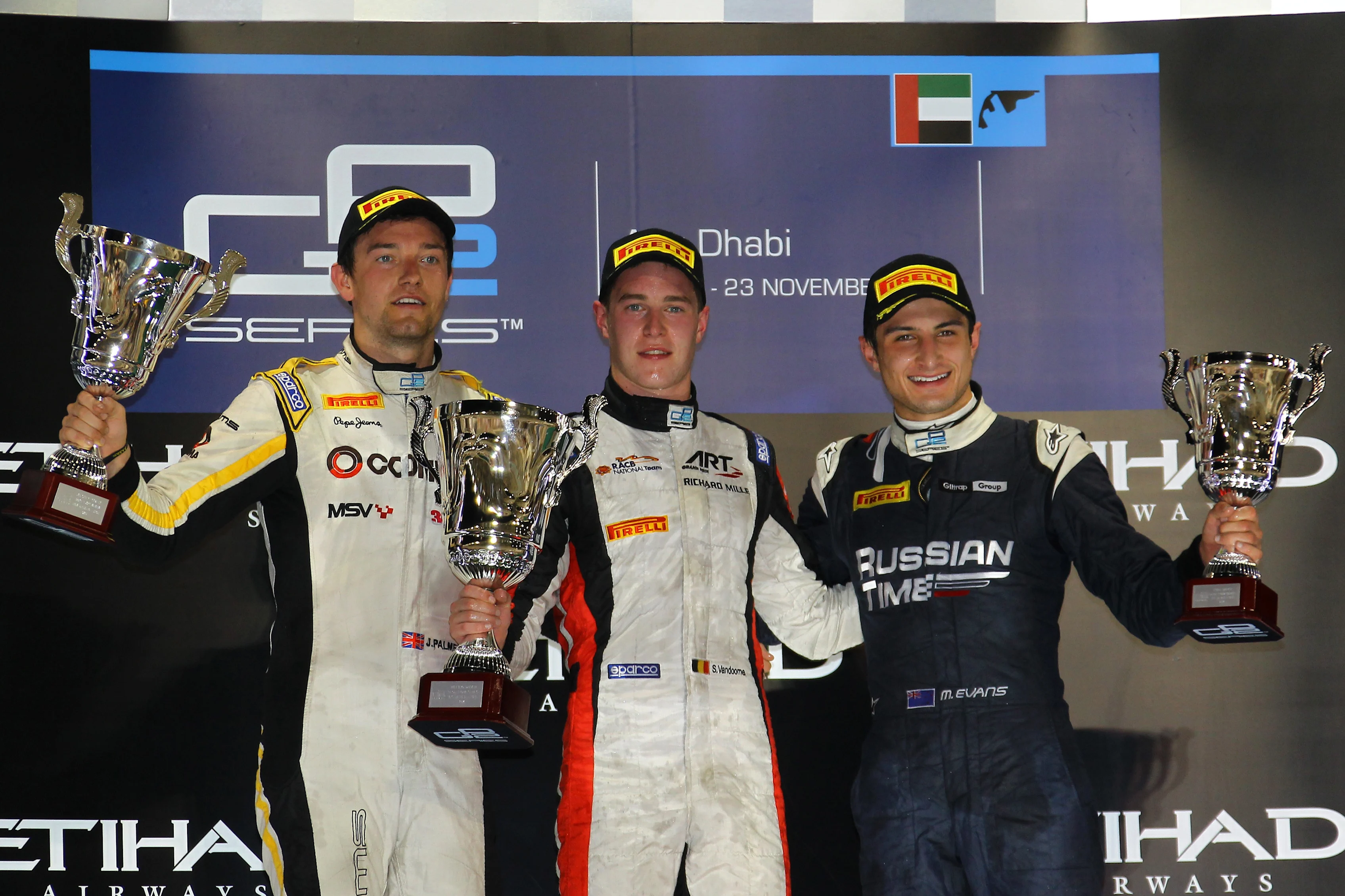Race one podium (L to R): Second placed Jolyon Palmer (GBR) DAMS, race winner Stoffel Vandoorne (BEL) ART Grand Prix and third placed Mitch Evans (NZL) Russian Time. GP2 Series, Rd11, Yas Marina Circuit, Abu Dhabi, UAE, 21-23 November 2014