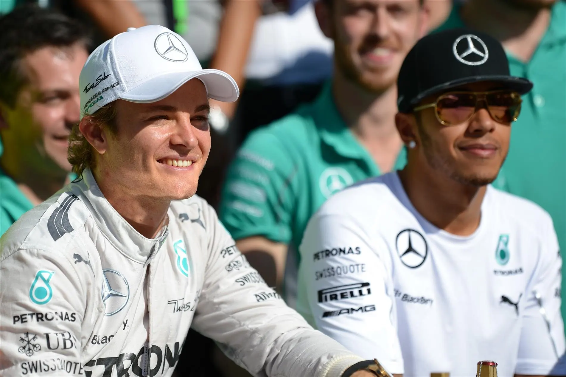 Nico Rosberg (GER) Mercedes AMG F1 celebrates with Lewis Hamilton (GBR) Mercedes AMG F1 and the team. Formula One World Championship, Rd18, Brazilian Grand Prix, Qualifying, Sao Paulo, Brazil, Sunday, 9 November 2014 