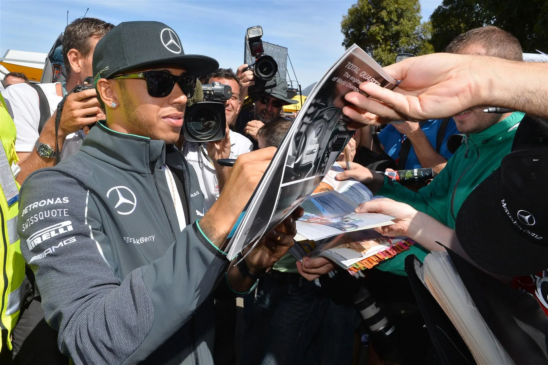 Lewis Hamilton (GBR) Mercedes AMG F1 signs autographs for the fans. Formula One World Championship, Rd1, Australian Grand Prix, Preparations, Albert Park, Melbourne, Australia, Thursday, 13 March 2014
