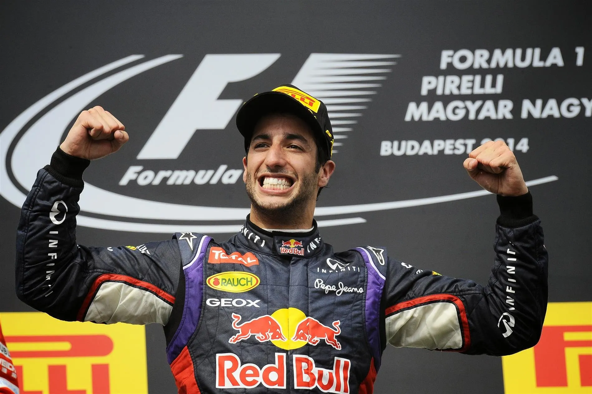 Race winner Daniel Ricciardo (AUS) Red Bull Racing celebrates on the podium. Formula One World Championship, Rd11, Hungarian Grand Prix, Race Day, Hungaroring, Hungary. Sunday, 27 July 2014 © Sutton Images. No reproduction without permission