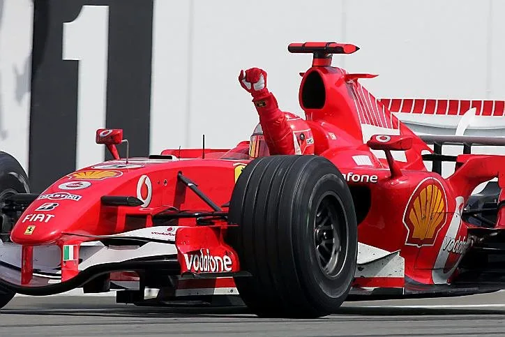Michael Schumacher (GER) Ferrari 248 F1 crosses the line to win the race. Formula One World Championship, Rd 12, German Grand Prix, Race, Hockenheim, Germany, 30 July 2006 © Sutton Images. No reproduction without permission