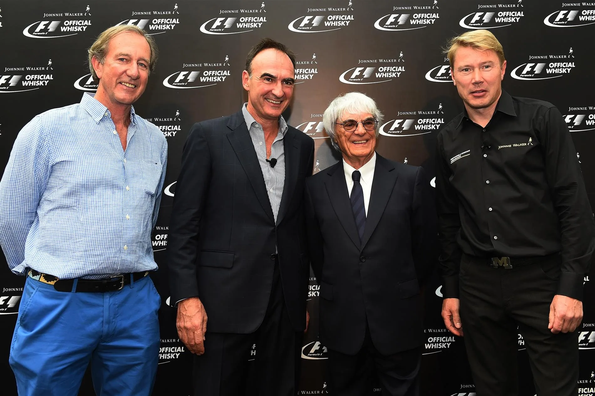 Nick Blazquez, President of Diageo in Africa and Asia with Bernie Ecclestone (GBR) CEO Formula One Group (FOM), Mika Hakkinen (FIN) and Robbie Walker (GBR). Formula One World Championship, Rd14, Singapore Grand Prix, Marina Bay Street Circuit, Singapore, Preparations, Thursday, 18 September 2014 © Sutton Images. No reproduction without permission
